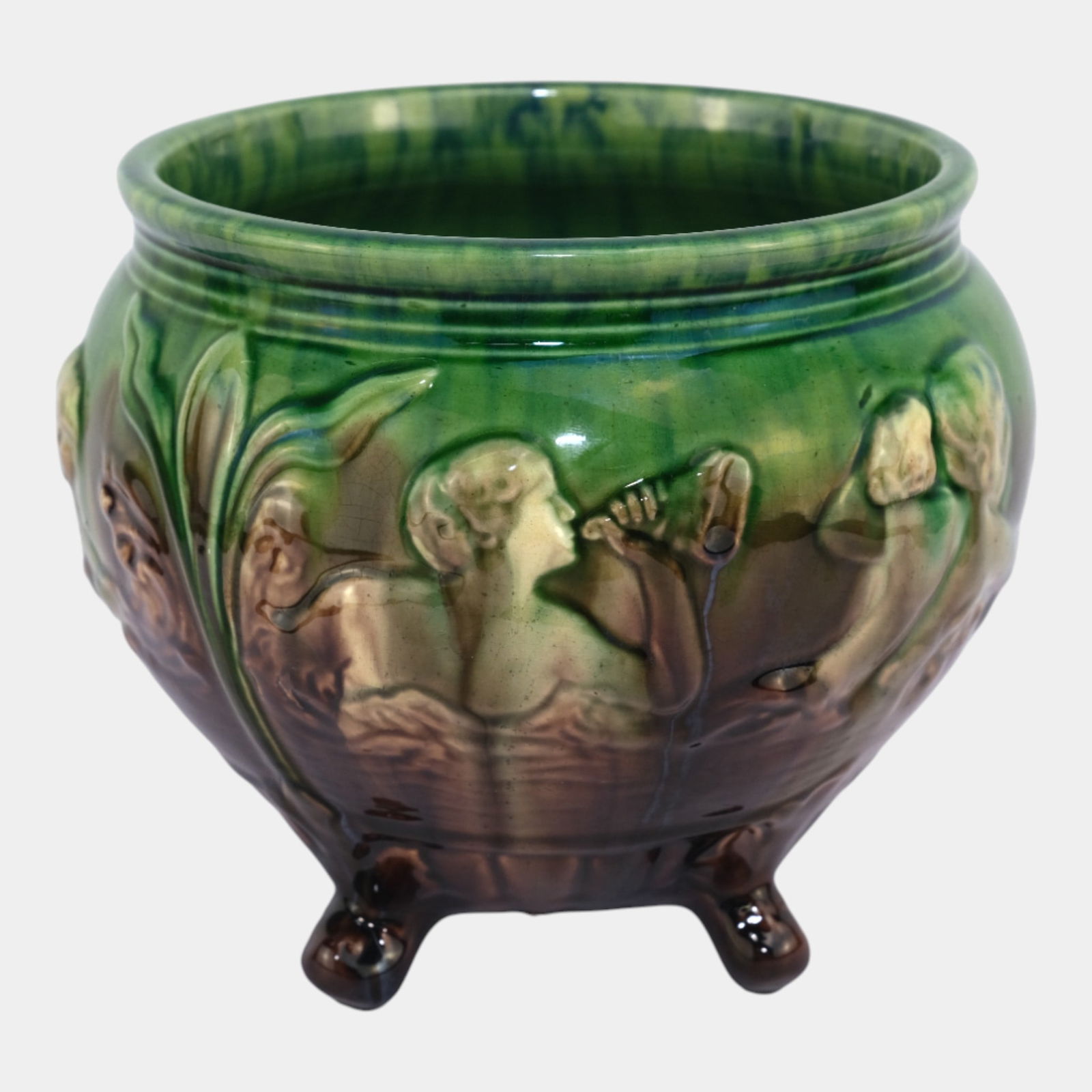 Weller Art Pottery Majolica Style Footed Sirens Of The Seas Mermaids Jardiniere: Weller Art Pottery Majolica Style Footed Sirens Of The Seas Mermaids Jardiniere Dramatic and alluring, this Weller Pottery jardiniÃ¨re features a glossy green and brown glaze over a sculpted relief