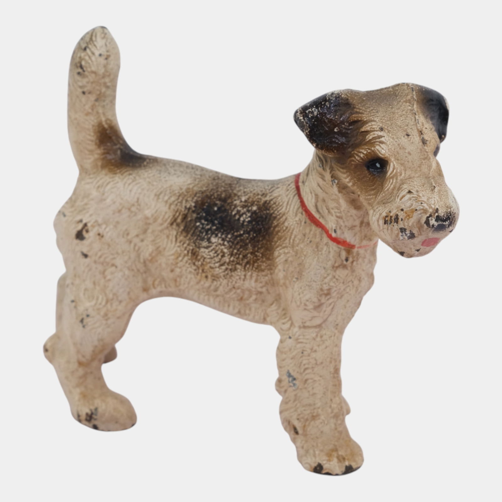 Hubley 1930s Brown White Cast Iron Wirehaired Fox Terrier Dog Bookend: Hubley 1930s Brown White Cast Iron Wirehaired Fox Terrier Dog Bookend Charmingly lifelike and sturdily cast, this early 20th-century Hubley bookend depicts a standing terrier dog with alert posture,