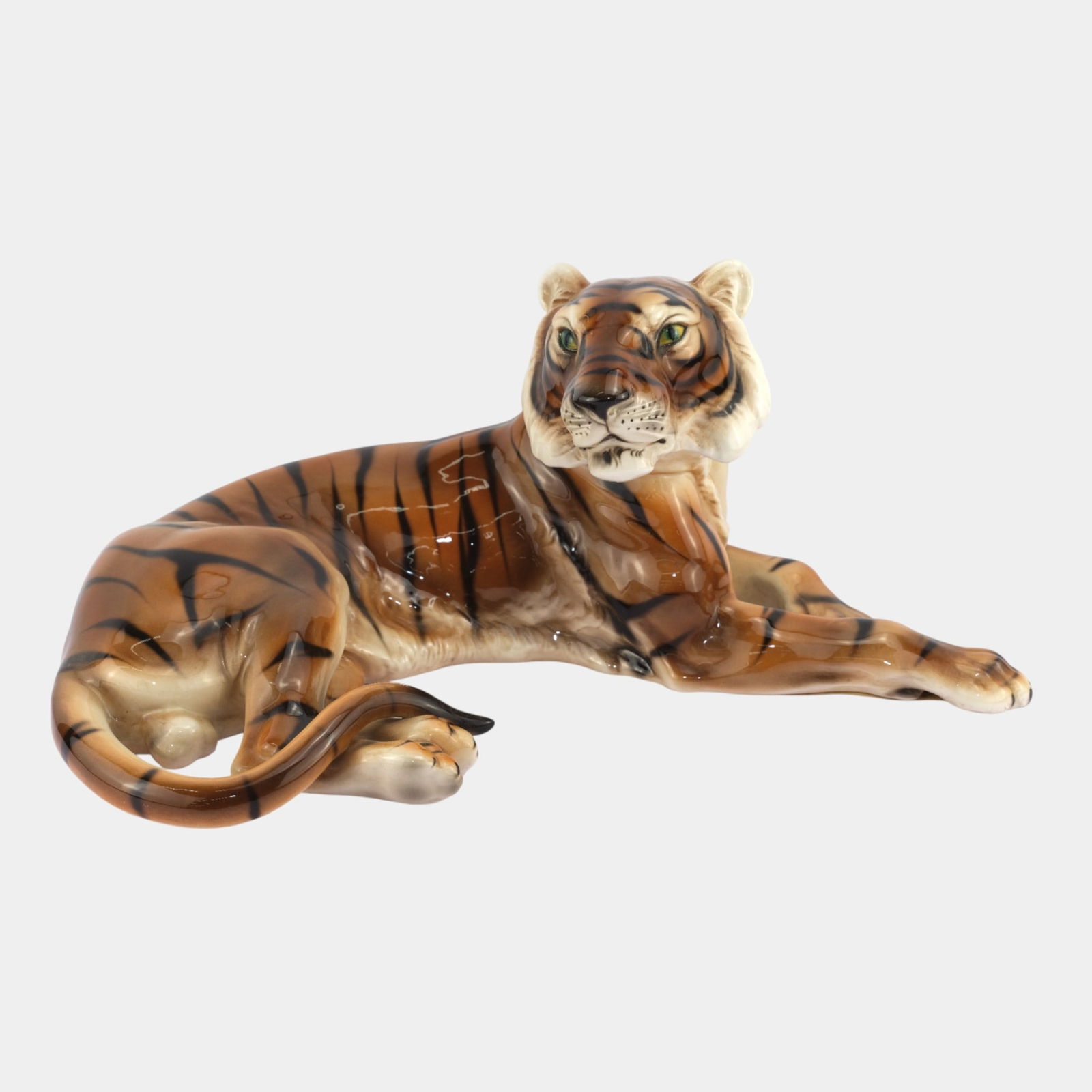 Keramos Wien Austrian Art Pottery Orange Reclining Tiger Porcelain Figurine: Keramos Wien Austrian Art Pottery Orange Reclining Tiger Porcelain Figurine Powerfully modeled and vividly naturalistic, this 1930s Keramos Wien tiger figure features a relaxed reclining pose with fin