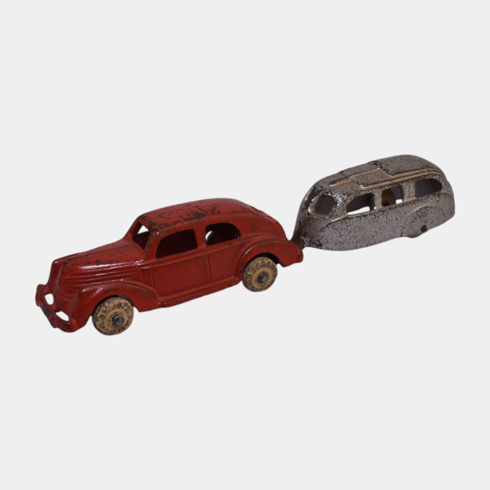 Hubley 1930s Cast Iron Toy Red Lincoln Zephyr #2272 and Silver Camper Trailer: Hubley 1930s Cast Iron Toy Red Lincoln Zephyr #2272 and Silver Camper Trailer Cast iron Hubley sedan in red with matching streamlined silver camper trailer. A classic 1930s toy pairing with original