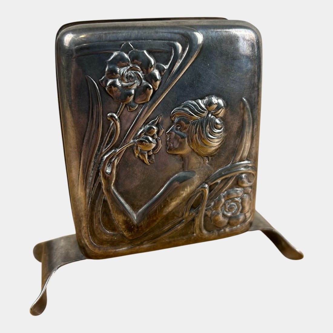 Late 19th Century Sterling Silver Art Nouveau Portugal Desk Letter Holder: Elegantly sculptural and sensuously curved, this Art Nouveau letter holder features a softly modeled female figure entwined with flowing floral forms, cast in warm bronze tones with sinuous lines and