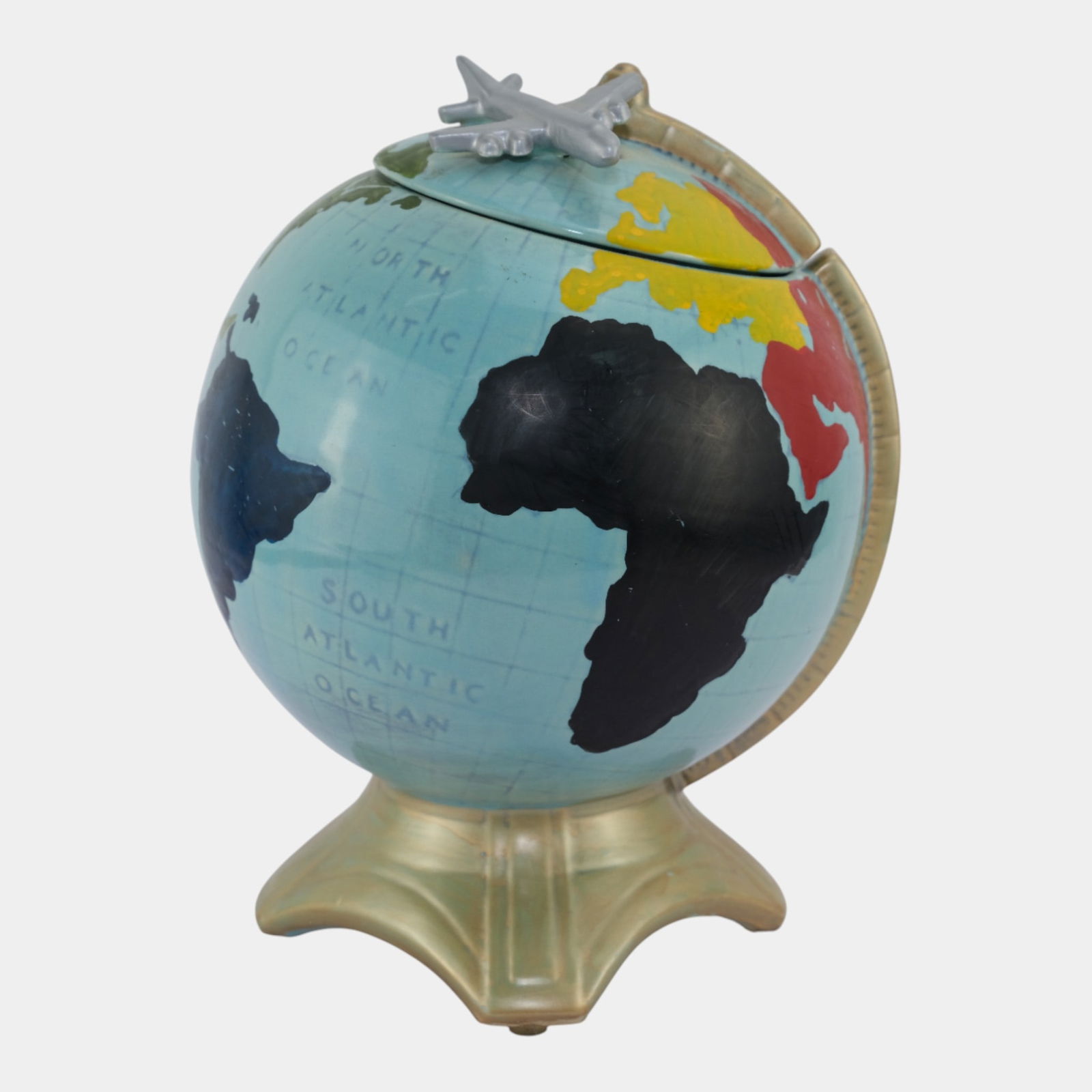McCoy Mid Century Modern Art Pottery Ceramic Globe Airplane Cookie Jar: McCoy Mid Century Modern Art Pottery Ceramic Globe Airplane Cookie Jar A McCoy multi-color, vintage World Globe Cookie Jar with a Silver Airplane mounted to its removeable lid. In excellent vintage co