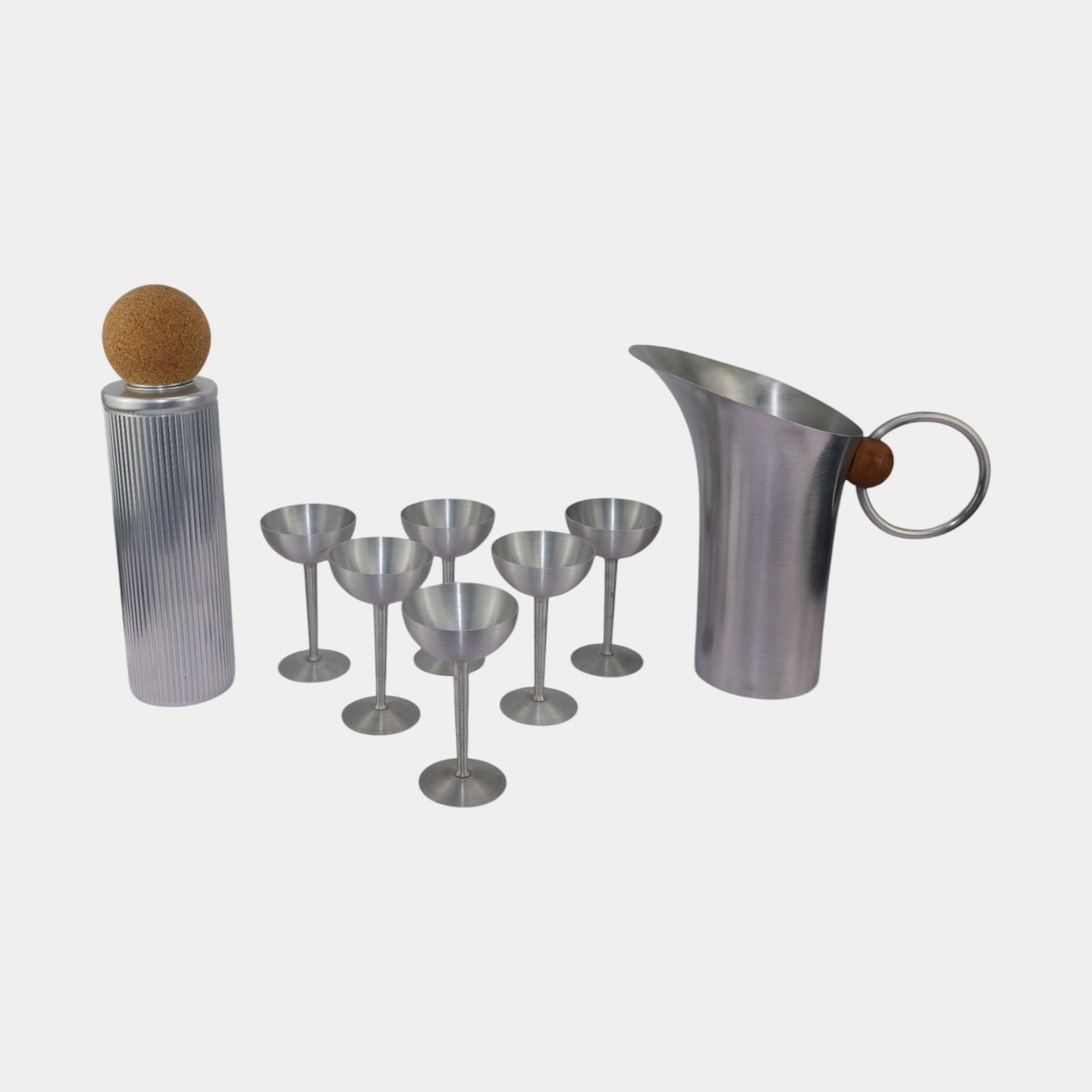 Russel Wright 1940s Cocktail Set With Shaker Pitcher and 6 Martini Glasses: Russel Wright 1940s Cocktail Set With Shaker Pitcher and 6 Martini Glasses Outstanding Machine Age Russel Wright ribbed aluminum skyscraper cocktail shaker with a large removable cork ball as lid. Int