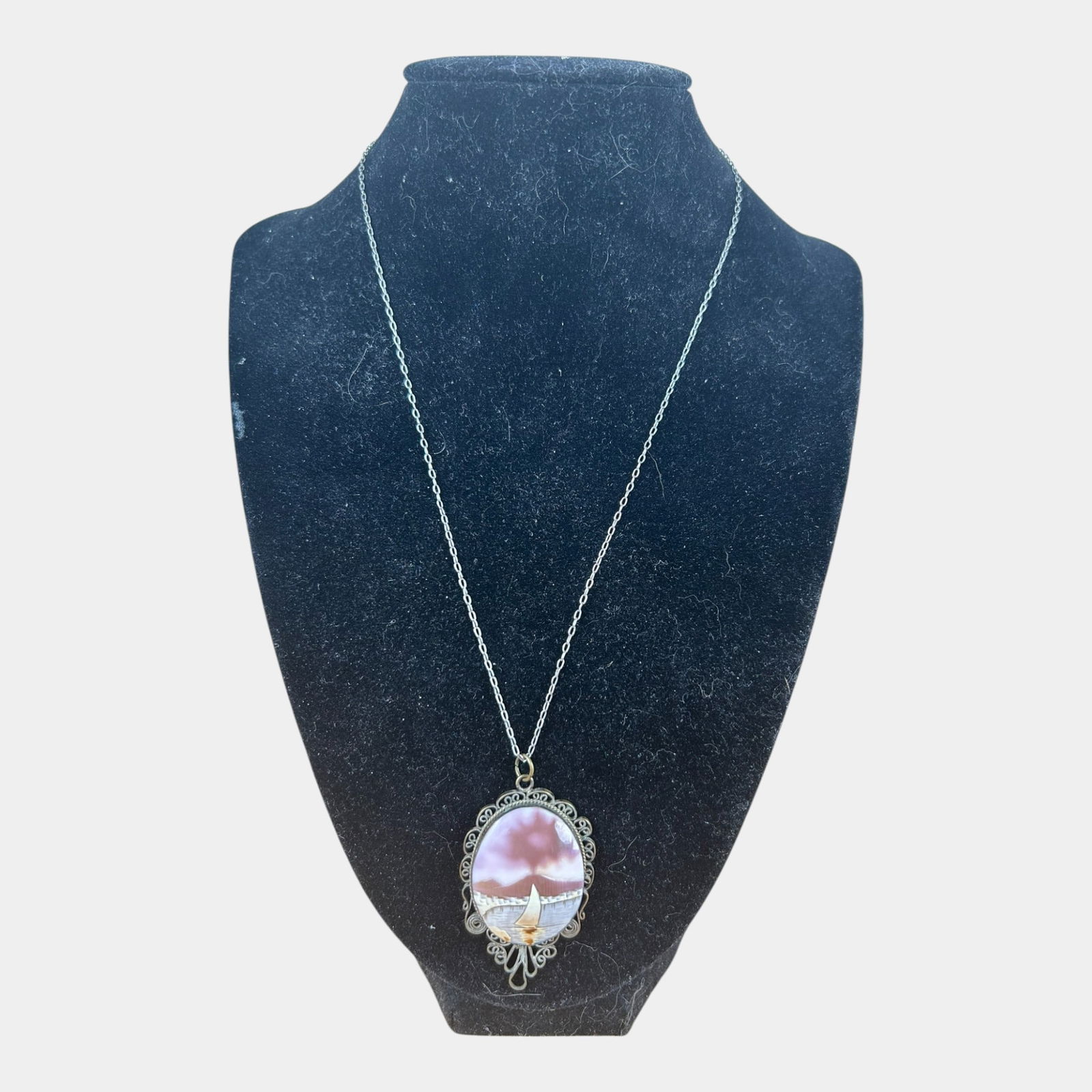 Carved Shell Scenic Cameo Pendant with Sailboat and Volcano: Professional, fast, and affordable in house shipping available for all items. Carved Shell Scenic Cameo Pendant with Sailboat and VolcanoDelicately detailed and atmospheric, this Italian shell cameo