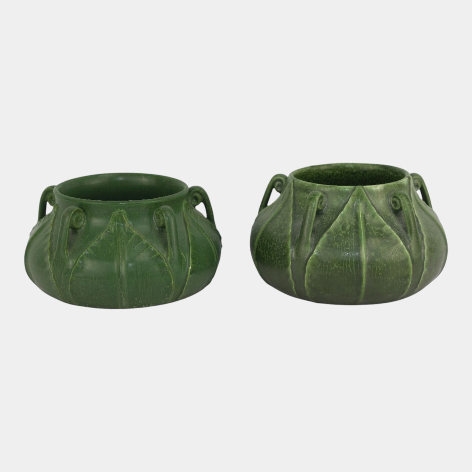 Ephraim Faience 2002 Matte Green Broad Leaf Fiddlehead Vases: We offer affordable in-house shipping on all items. Ephraim Faience 2002 Matte Green Broad Leaf Fiddlehead Vases Beautiful pair of Ephraim Faience vases in deep matte green glazes, each adorned with