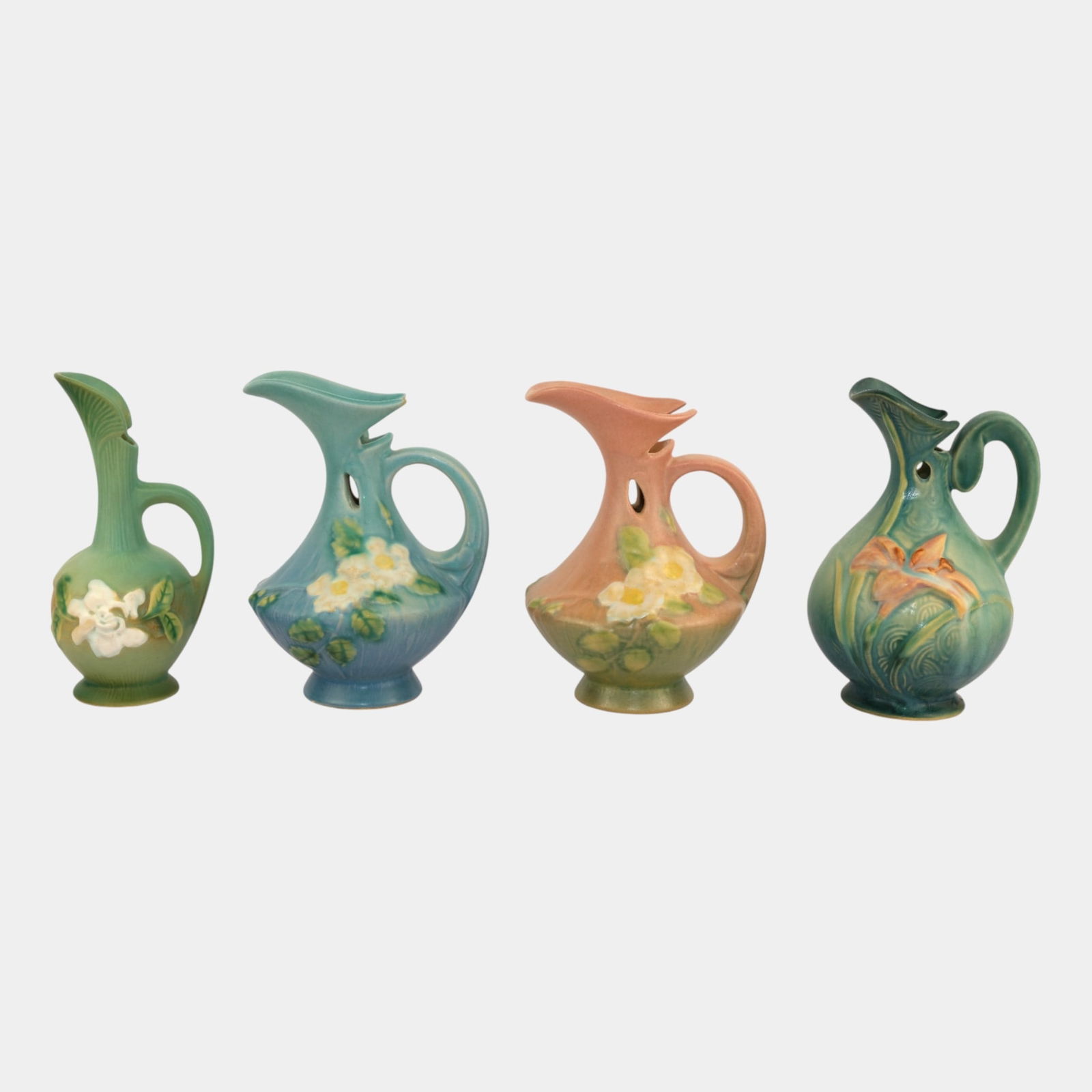 Roseville White Rose Gardenia Zephyr Lily Pink Blue Green Ewers: Professional, fast, and affordable in house shipping available for all items. Roseville White Rose Gardenia Zephyr Lily Pink Blue Green Ewers Excellent condition. Shows well with small nick to spout