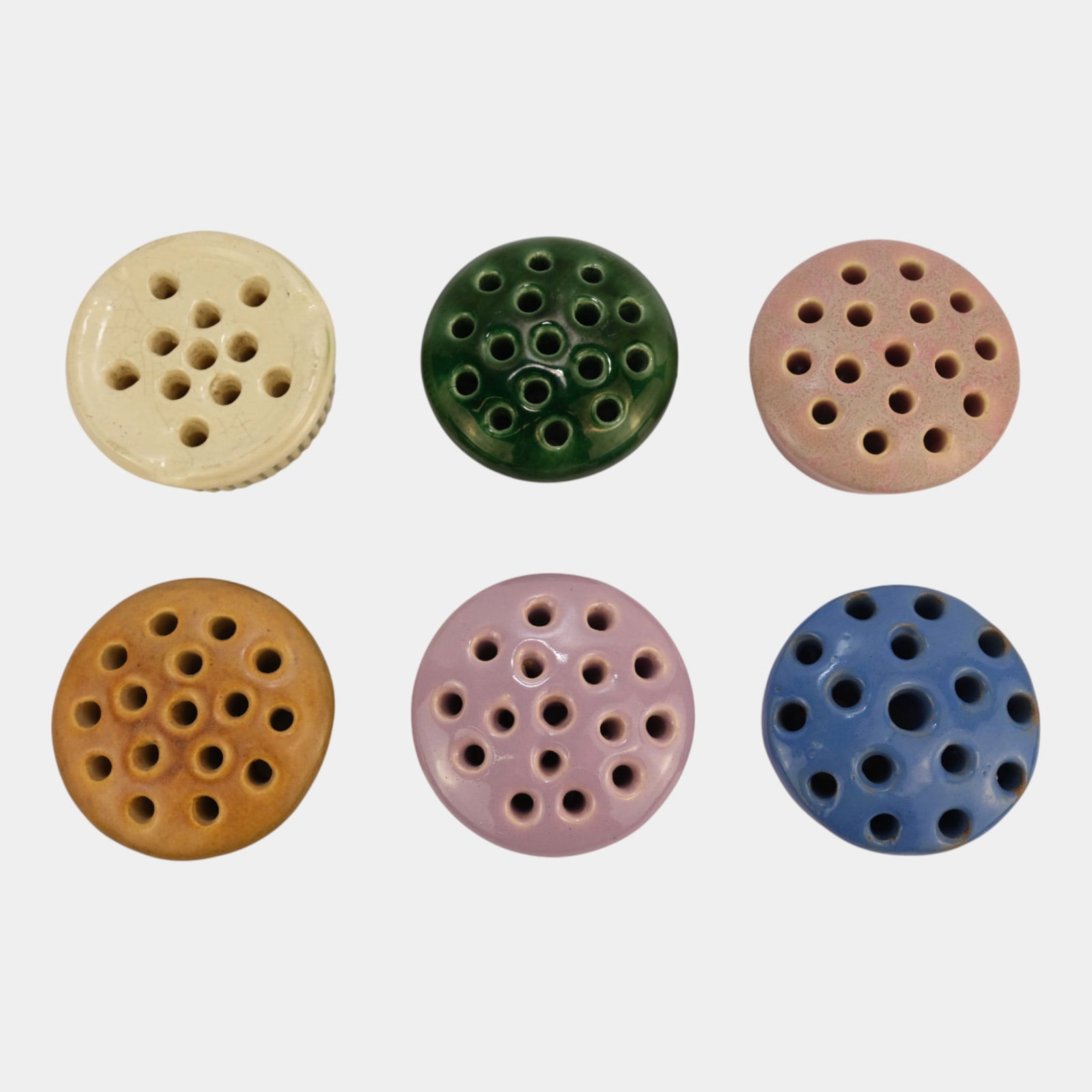 Roseville Pottery Donatello Various Color Flower Frogs: Professional, fast, and affordable in house shipping available for all items. Roseville Pottery Donatello Various Color Flower Frogs Excellent condition. Age related wear. Bottom marked as shown. Lar