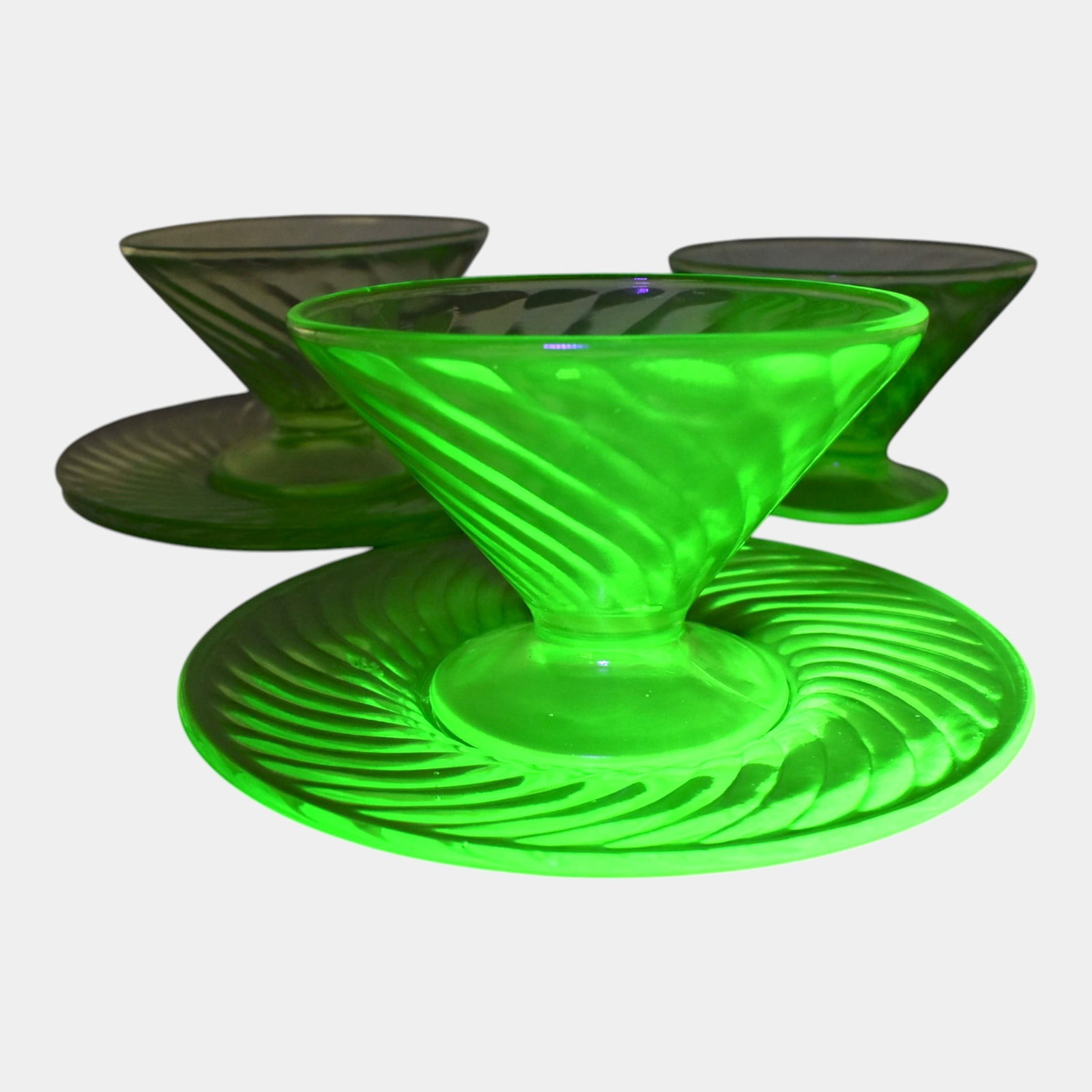 Uranium Green Depression Glass Sherbet Cups And Saucers: Professional, fast, and affordable in house shipping available for all items. Uranium Green Depression Glass Sherbet Cups And Saucers Excellent condition. Each piece glows green under UV light. Nicks