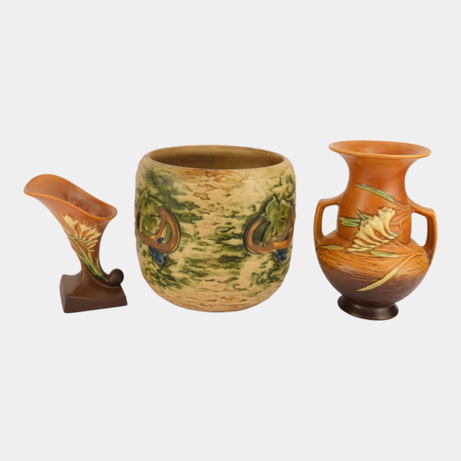 Roseville Pottery Imperial I Brown Jardiniere And Two Brown Freesia Vases: We offer affordable in-house shipping on all items. Roseville Pottery Imperial I Brown Jardiniere And Two Brown Freesia Vases Glaze chipping to the inside of jardiniere. Crazing to the outside. Small 