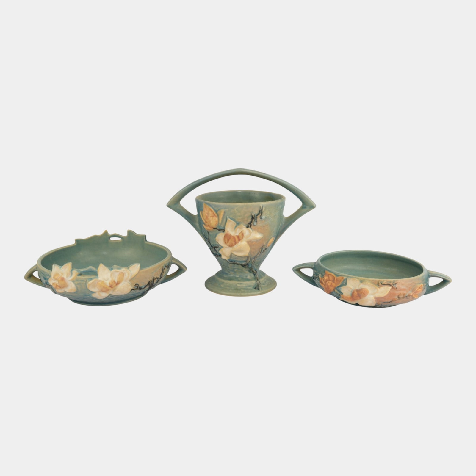 Roseville Magnolia Blue Handled Basket Bowls: We offer affordable in-house shipping on all items. Roseville Magnolia Blue Handled Basket Bowls Excellent condition. Age related wear. Bottoms marked as shown. Tallest item is 8 1/4" tall and 10" wid