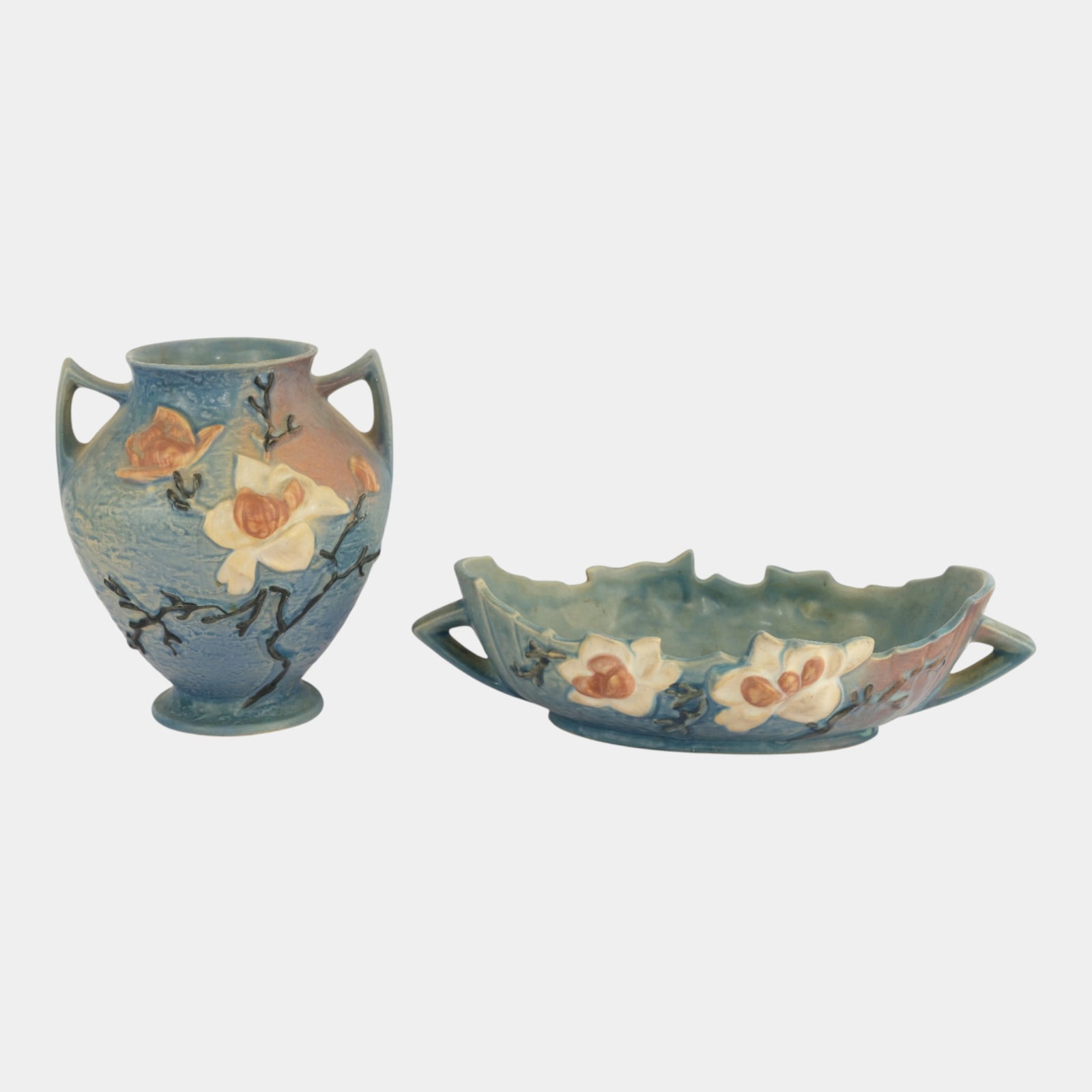 Roseville Magnolia Blue Vase Console Bowl: We offer affordable in-house shipping on all items. Roseville Magnolia Blue Vase Console Bowl Excellent condition. Age related wear. Bottom marked as shown. Item is 8 1/4" tall and 7 1/4" wide.