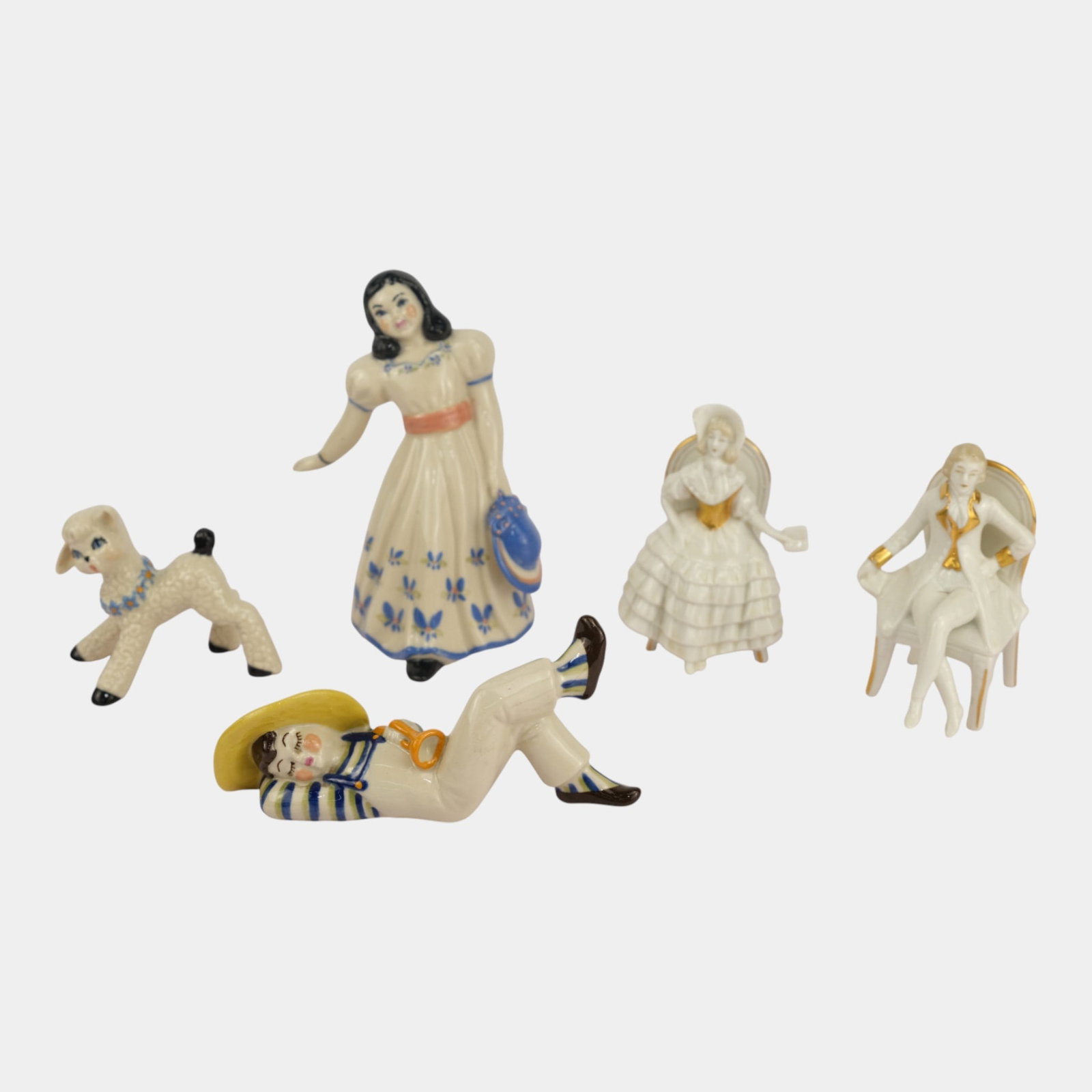 Ceramics Arts Studio Figurines And Capodimonte Porcelain Seated Figurines: We offer affordable in-house shipping on all items. Ceramics Arts Studio Figurines And Capodimonte Porcelain Seated Figurines Excellent condition. Age related wear. Bottom marked as shown. Tallest fig