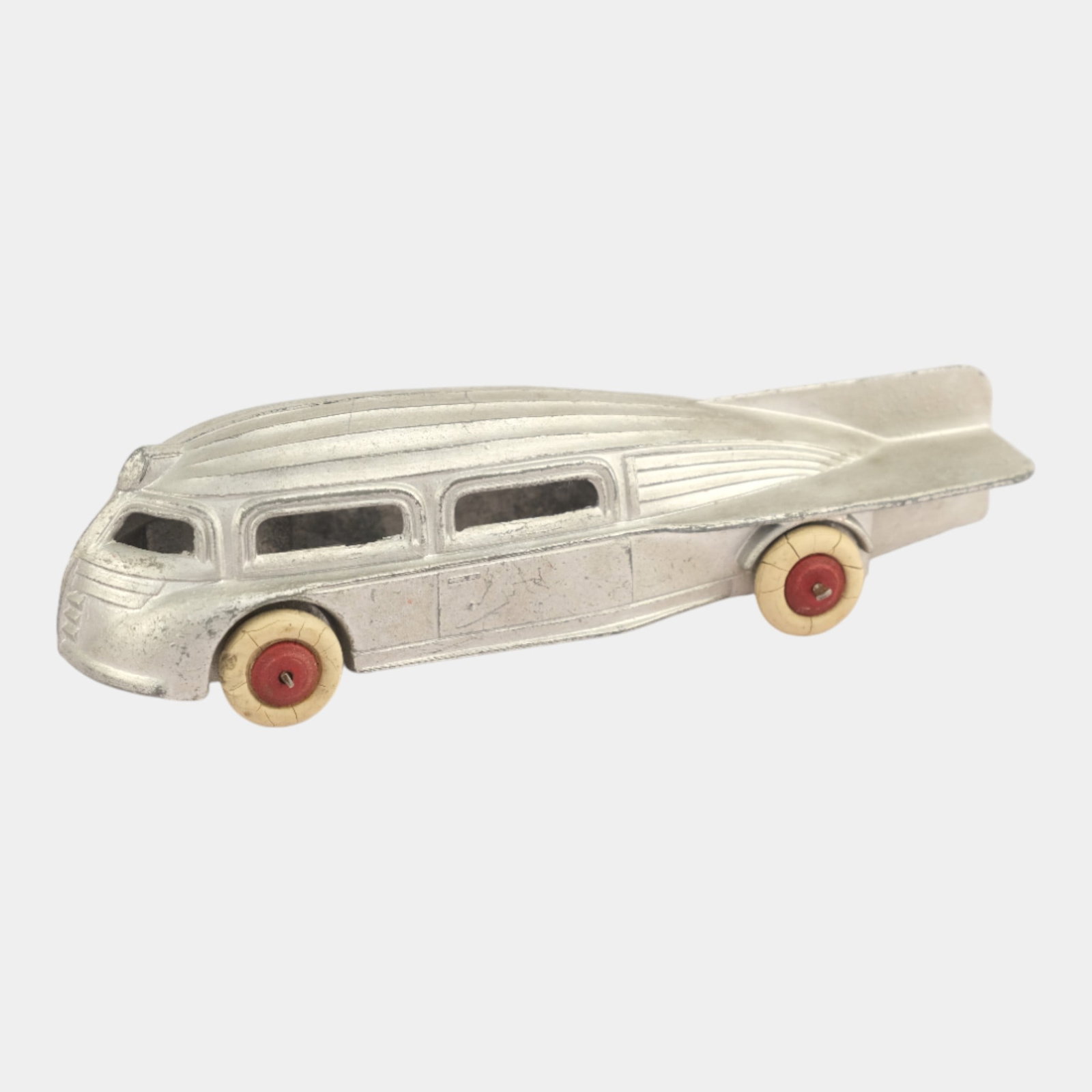 Manoil USA 1940s Pressed Steel 706 Silver Futuristic Roadster: We offer affordable in-house shipping on all items. Manoil USA 1940s Pressed Steel 706 Silver Futuristic Roadster Excellent condition. Age related wear. Bottom marked as shown. Roadster is 1 3/4" tall