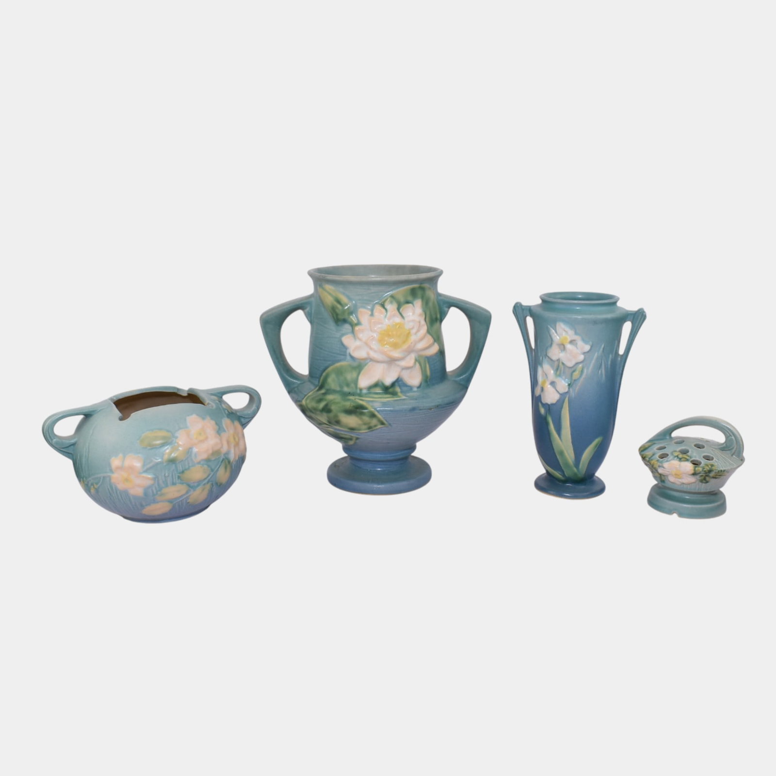 Roseville White Rose Iris Water Lily Vases Flower Frog: We offer affordable in-house shipping on all items. Roseville White Rose Iris Water Lily Vases Flower Frog Nice form and glaze. Excellent condition. Age related wear. Tallest piece is 8 1/4" tall and 