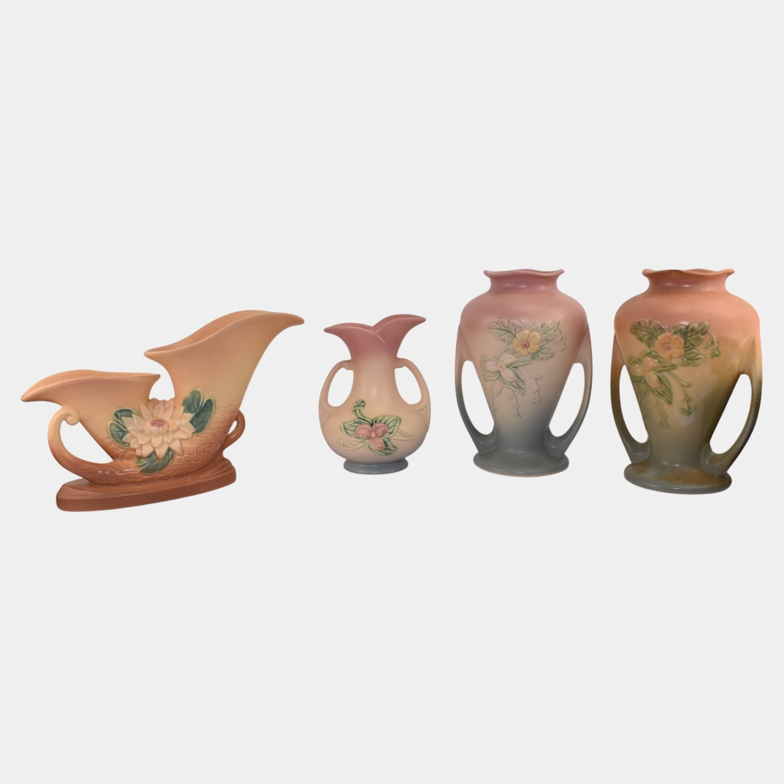 Hull Art Pottery Water Lily Wildflower Handled Vases And Double Cornucopia: We offer affordable in-house shipping on all items. Hull Art Pottery Water Lily Wildflower Handled Vases And Double Cornucopia One vase has chip to rim. Age related wear. Tallest item is 9 3/4" tall a