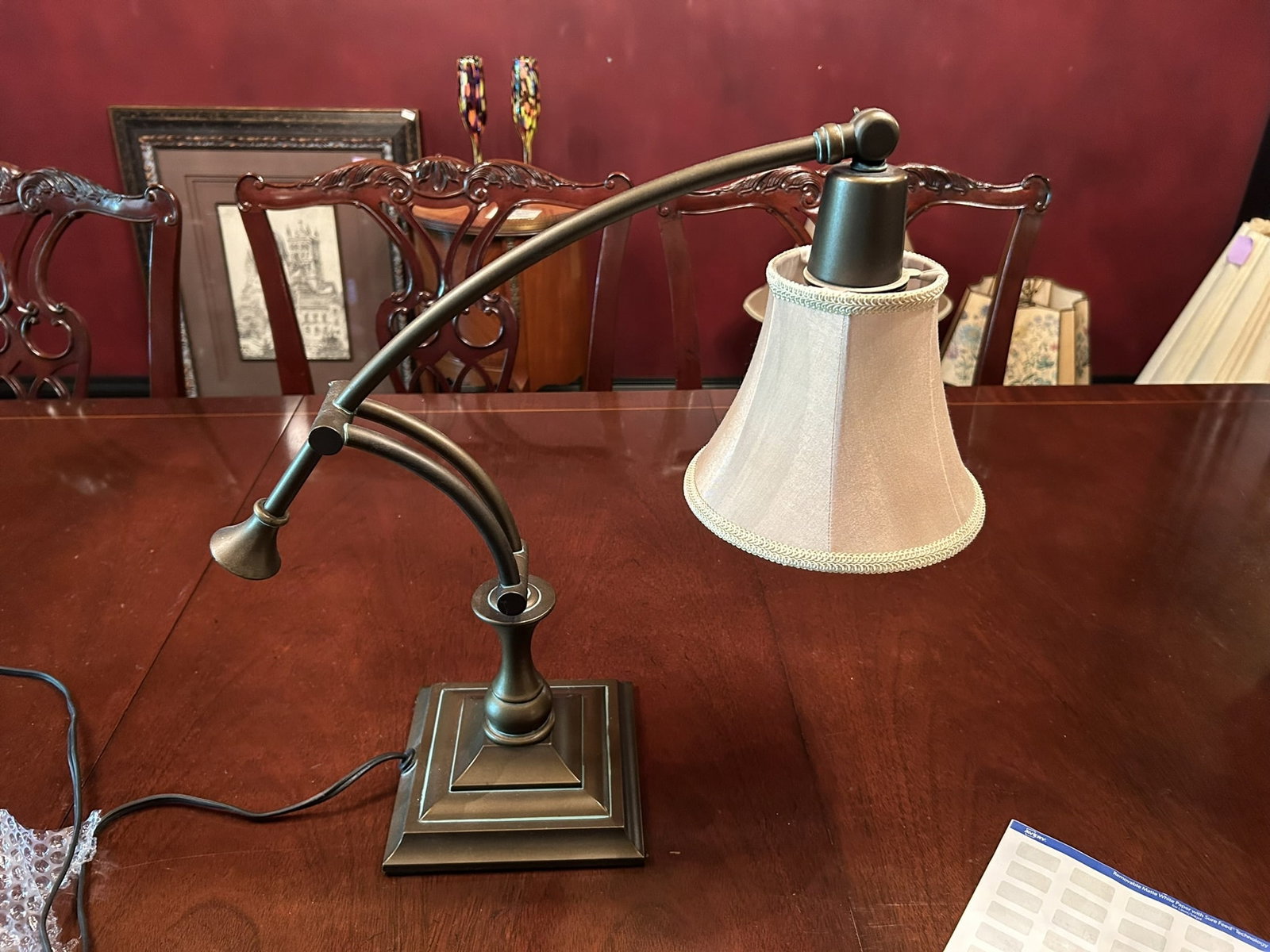 Traditional Bronze Finish Adjustable Arm Desk Table Lamp With Fabric Shade: We offer affordable in-house shipping on all items. Traditional Bronze Finish Adjustable Arm Desk Table Lamp With Fabric Shade Excellent condition. Age related wear. Lamp is 18" tall and 18" wide.