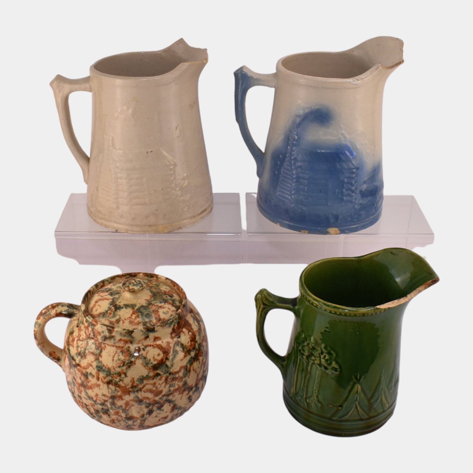 Uhl American Art Pottery Primitive Stoneware Handled Pitcher Grouping: We offer affordable in-house shipping on all items.For higher resolution images please visit bid.craftedauctions.com Uhl American Art Pottery Primitive Stoneware Handled Pitcher Grouping Sold as is wi