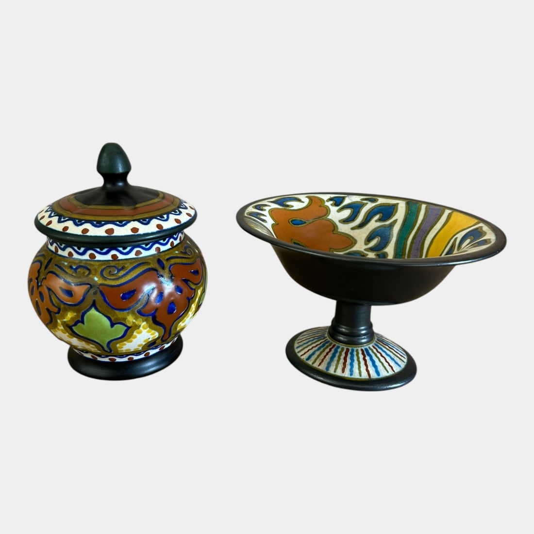 Gouda Holland Beek And Dolly Black Green Art Nouveau Lidded Jar & Pedestal Bowl: We offer affordable in-house shipping on all items.For higher resolution images please visit bid.craftedauctions.com Gouda Holland Beek And Dolly Black Green Art Nouveau Lidded Jar & Pedestal Bowl Con