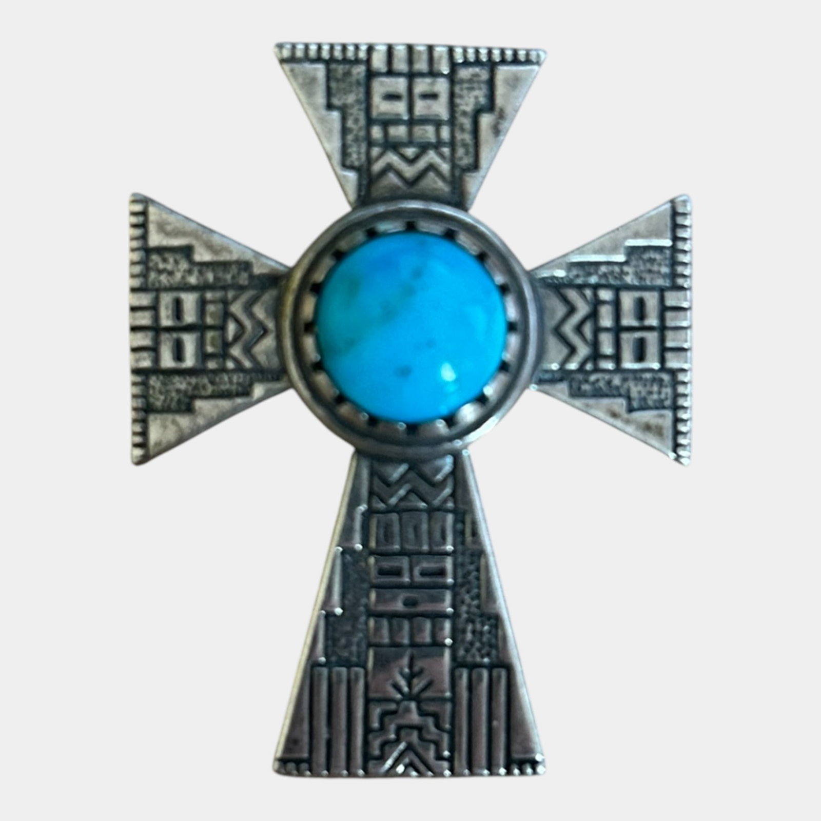 Roderick & Marilyn Tenorio Native American Kewa Sterling Silver & Turquoise Cross Pendant: We offer affordable in-house shipping on all items.For higher resolution images please visit bid.craftedauctions.com Crafted by Roderick & Marilyn Tenorio (Kewa), this sterling silver cross pendant fe