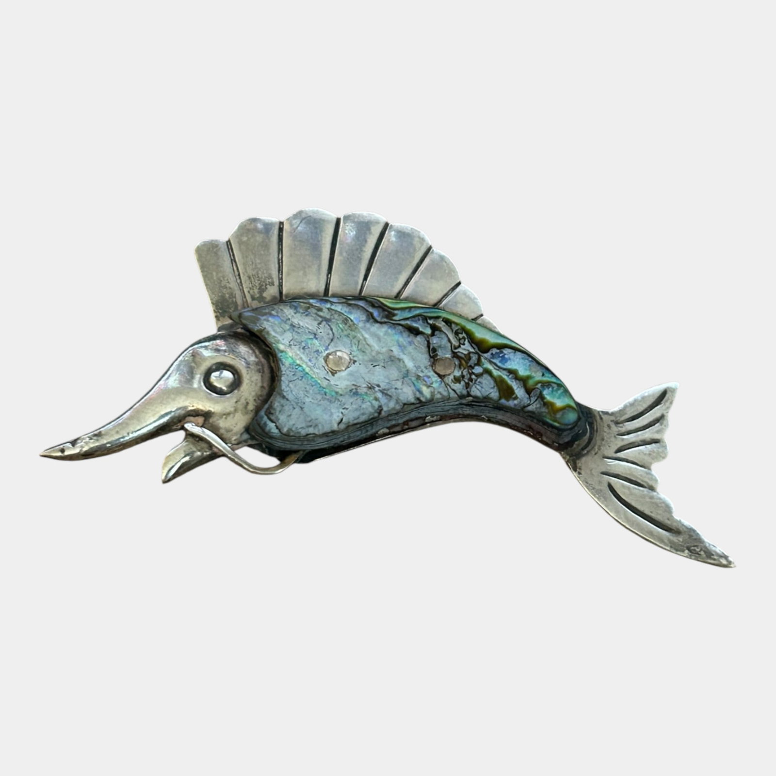 Ana María Núñez de Brilanti For Taxco Mexico Sterling Silver & Iridescent Abalone Mid Century: We offer affordable in-house shipping on all items.For higher resolution images please visit bid.craftedauctions.com This vintage sterling silver brooch is crafted as a stylized fish with iridescent a