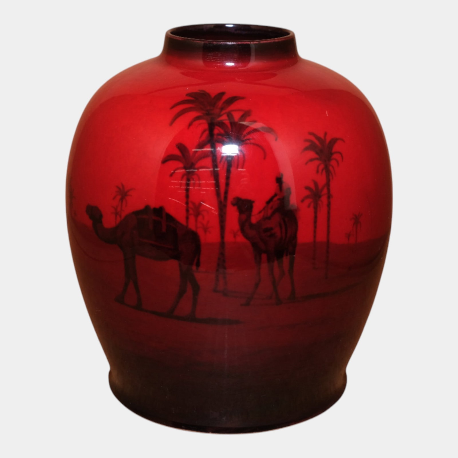 Royal Doulton English Art Pottery Red Flambe Bulbous Scenic Desert Camel Vase: We offer affordable in-house shipping on all items.For higher resolution images please visit bid.craftedauctions.com Royal Doulton English Art Pottery Red Flambe Bulbous Scenic Desert Camel Vase Drama