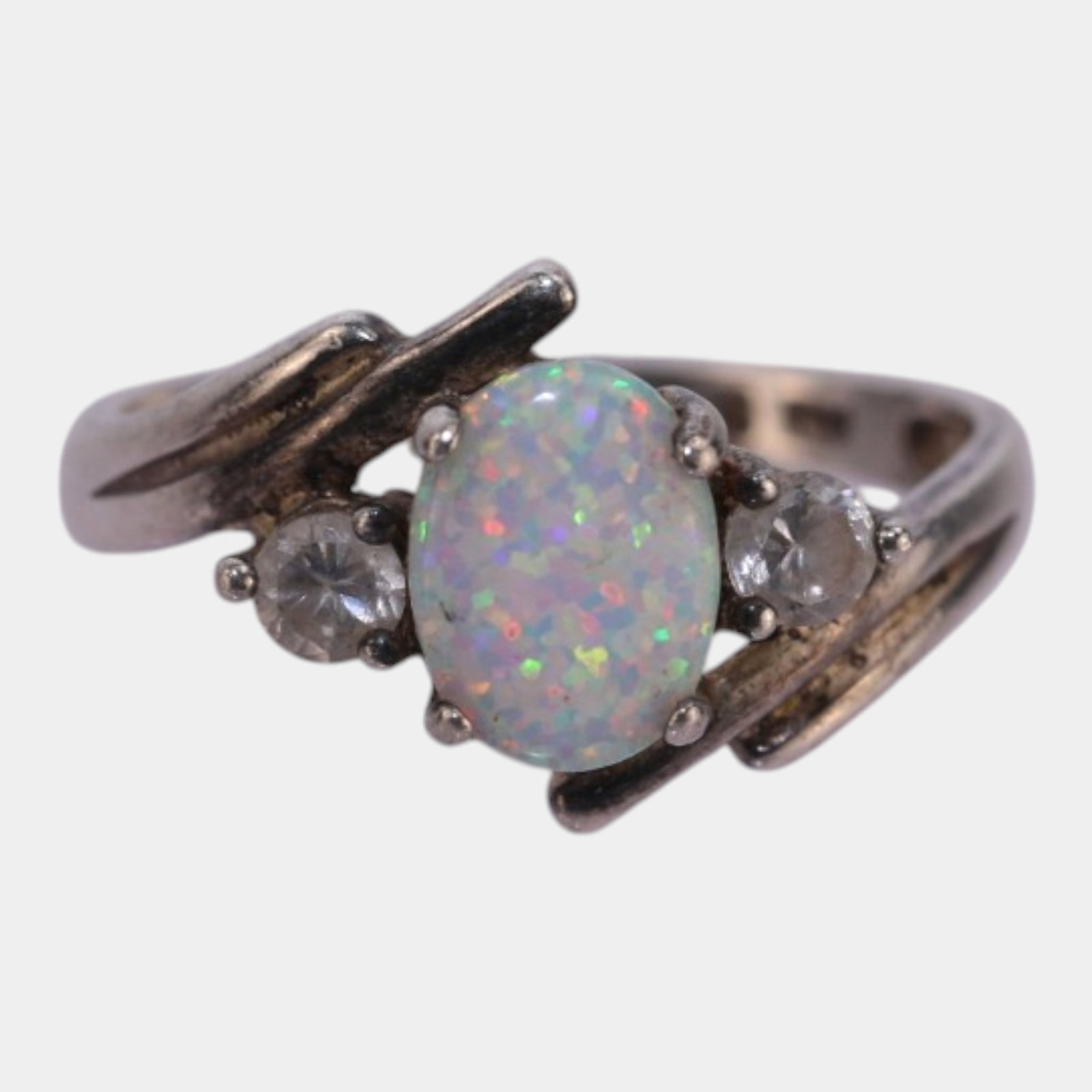 Sterling Silver, Lab Created Opal & CZ Bypass Ring With Modernist Organic Design Size 6: We offer affordable in-house shipping on all items.For higher resolution images please visit bid.craftedauctions.com Elegantly luminous and softly sculptural, this sterling silver bypass ring features