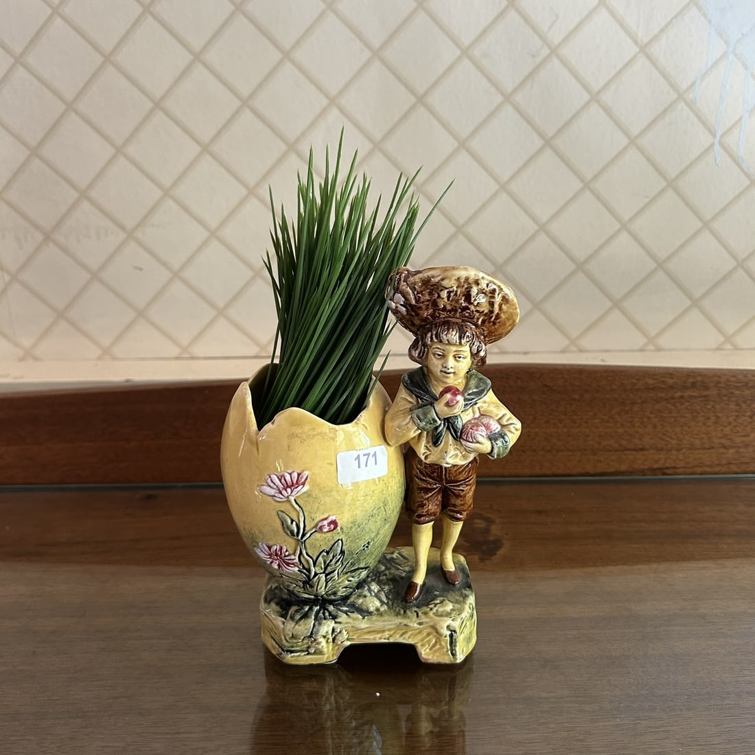European Late 19th Century Victorian Majolica Glazed Figural Boy With Apple Egg Form Planter Vase: Professional, fast, and affordable in house shipping available for all items.For higher resolution images please visit www.bid.craftedauctions.com European Late 19th Century Victorian Majolica Glazed 