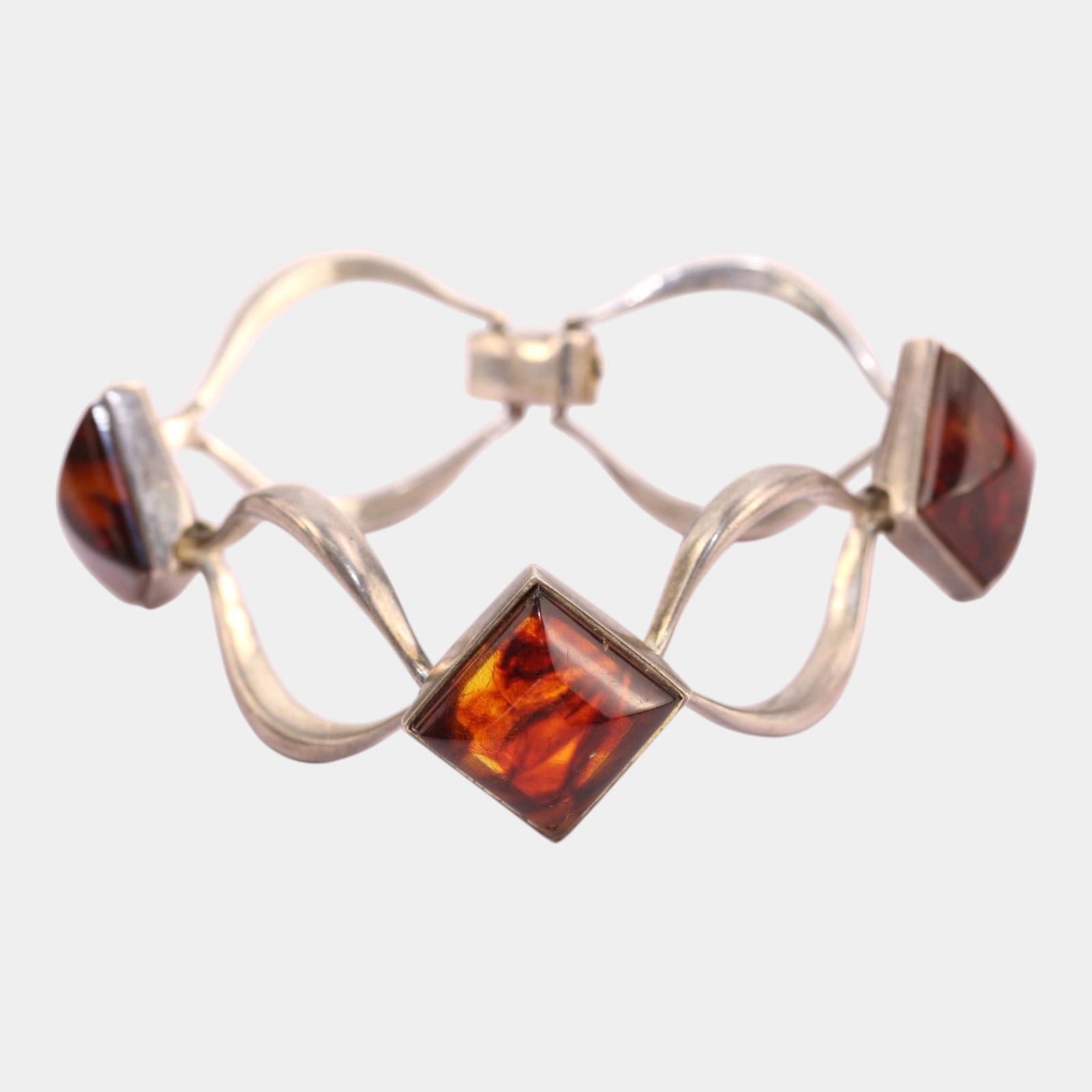 Sterling Silver 925 German Mid Century Modernist Amber Stone Openwork Bracelet: Professional, fast, and affordable in house shipping available for all items.For higher resolution images please visit www.bid.craftedauctions.com Fluidly sculptural and distinctly modernist, this vin
