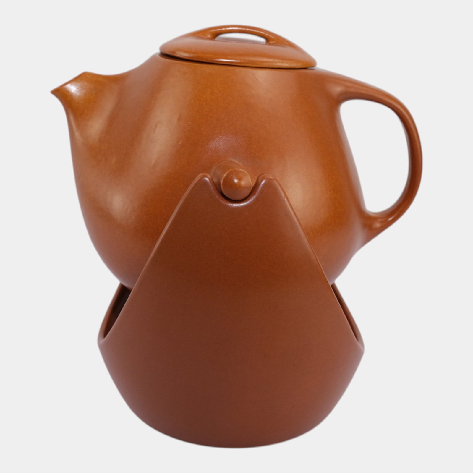 Roseville Raymor Pumpkin 1952 Mid Century Modern Swinging Coffee Pot And Stand: Professional, fast, and affordable in house shipping available for all items.For higher resolution images please visit www.bid.craftedauctions.com Roseville Raymor Pumpkin 1952 Mid Century Modern Swin