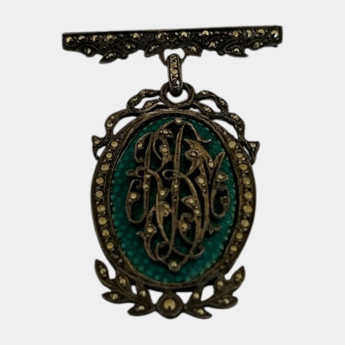 Sterling Silver Marcasite Monogrammed Brooch Pendant With Green Guilloche Enamel Center: Professional, fast, and affordable in house shipping available for all items.For higher resolution images please visit www.bid.craftedauctions.com Elegantly crafted sterling silver brooch pendant feat