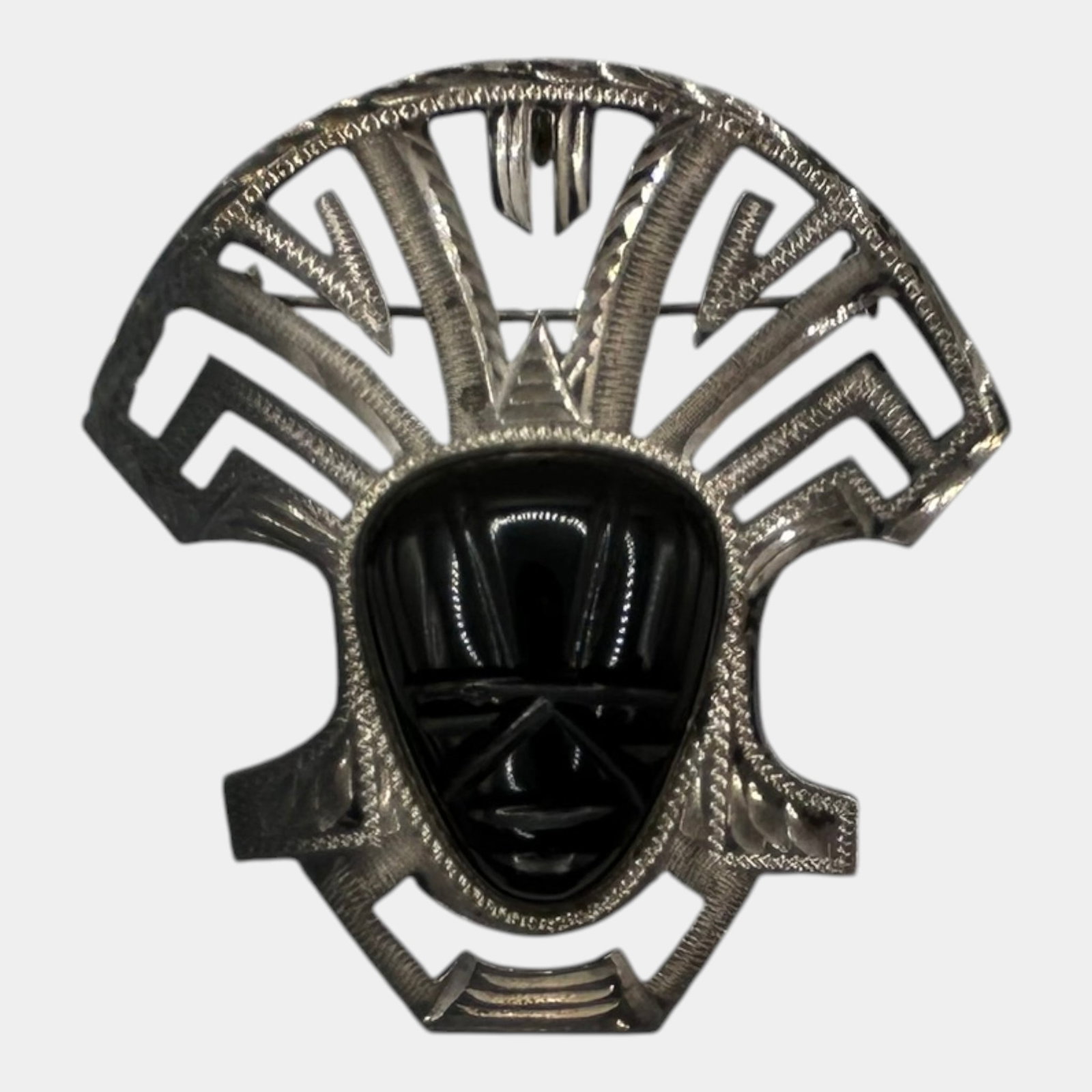 Taxco Mexico Sterling Silver Carved Obsidian Aztec Face Pendant Mid Century Modern: Professional, fast, and affordable in house shipping available for all items.For higher resolution images please visit www.bid.craftedauctions.com Bold Taxco Mexico sterling silver pendant featuring a