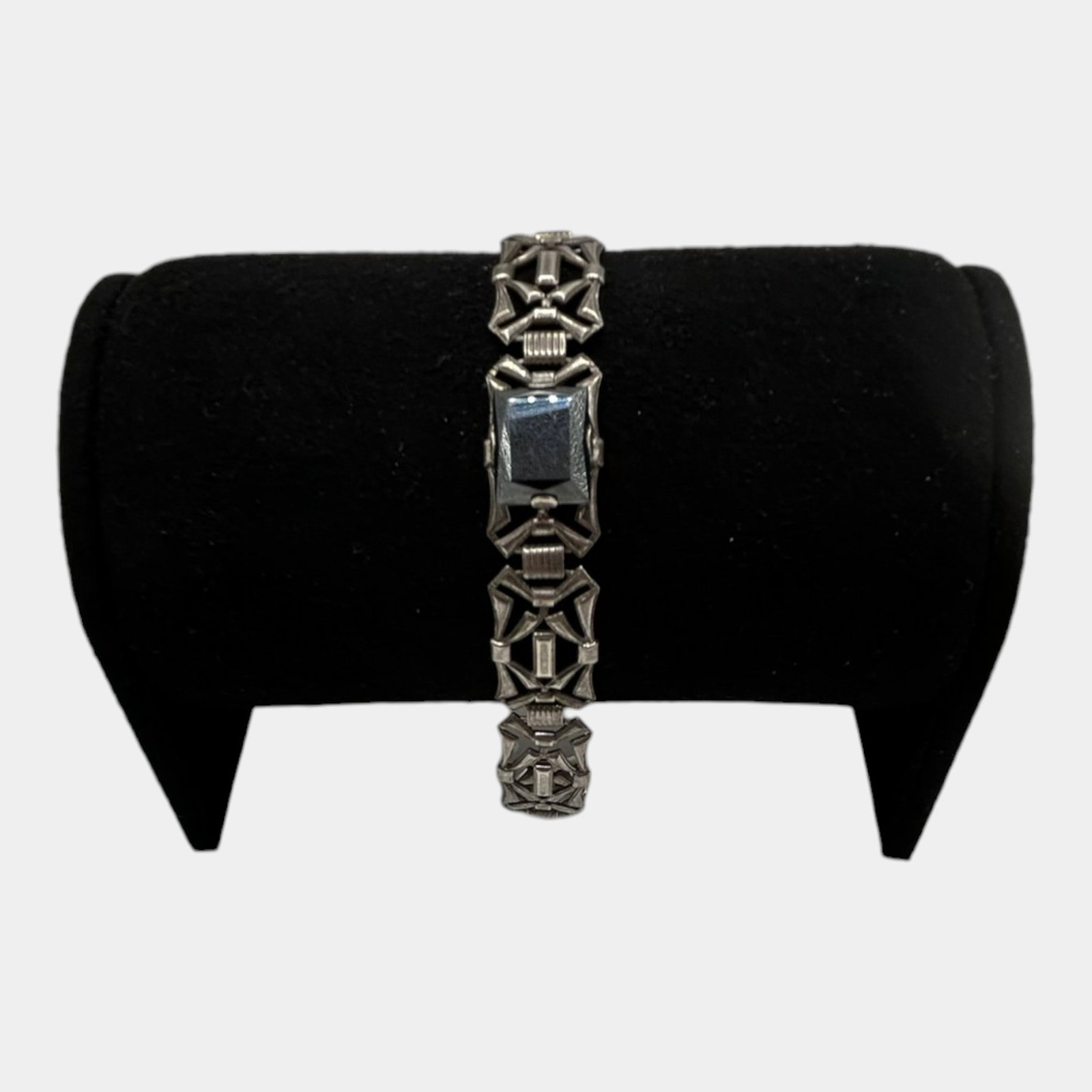 Sterling Silver Art Deco Hematite Bracelet With Geometric Openwork Link Design 6.5" Long: Professional, fast, and affordable in house shipping available for all items.For higher resolution images please visit www.bid.craftedauctions.com Striking sterling silver bracelet featuring a central