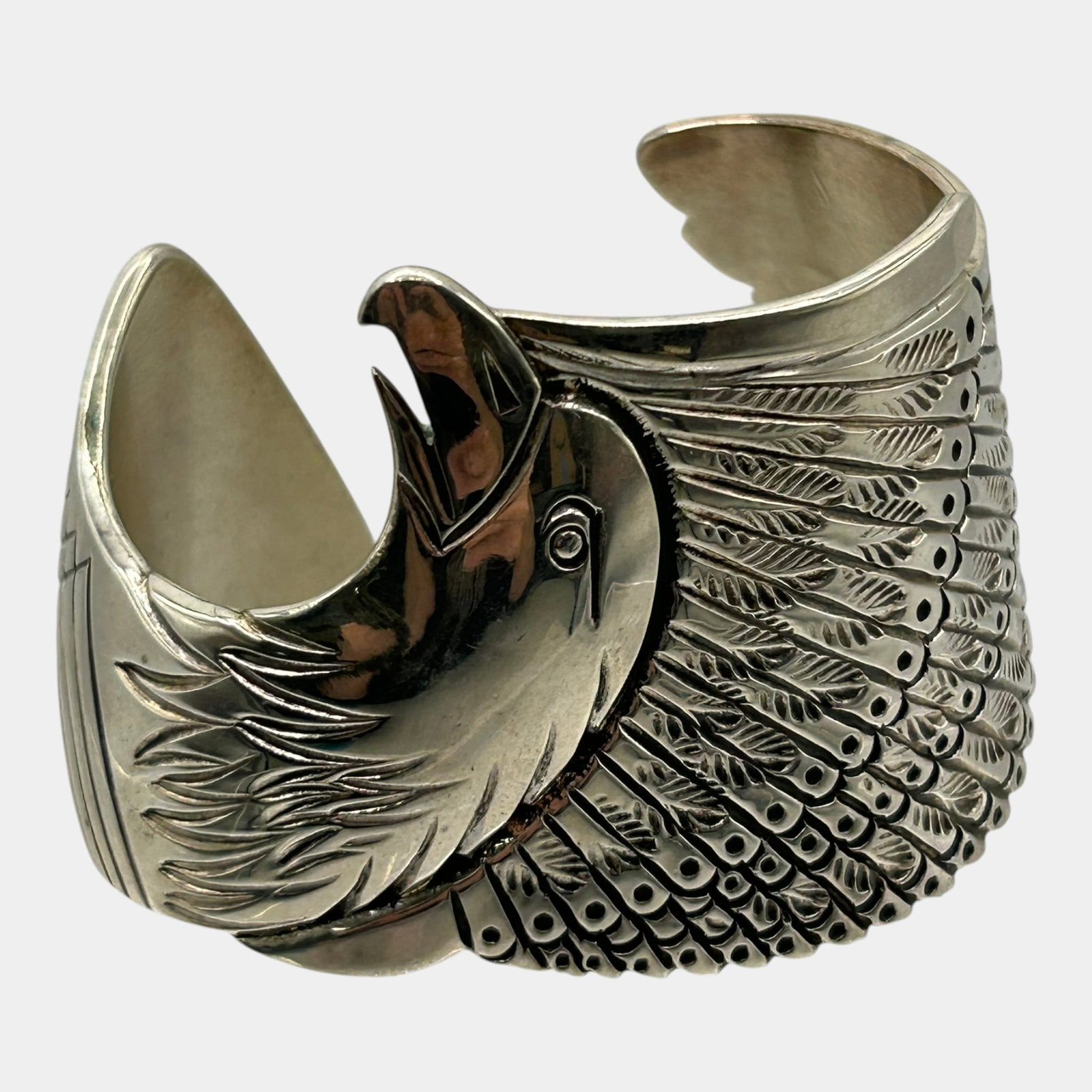 Charles Bowie Navajo Sterling Silver Sculptural Bald Eagle Feathered Cuff Bracelet: Professional, fast, and affordable in house shipping available for all items.For higher resolution images please visit www.bid.craftedauctions.com Exceptional Charles Bowie Navajo Native American ster