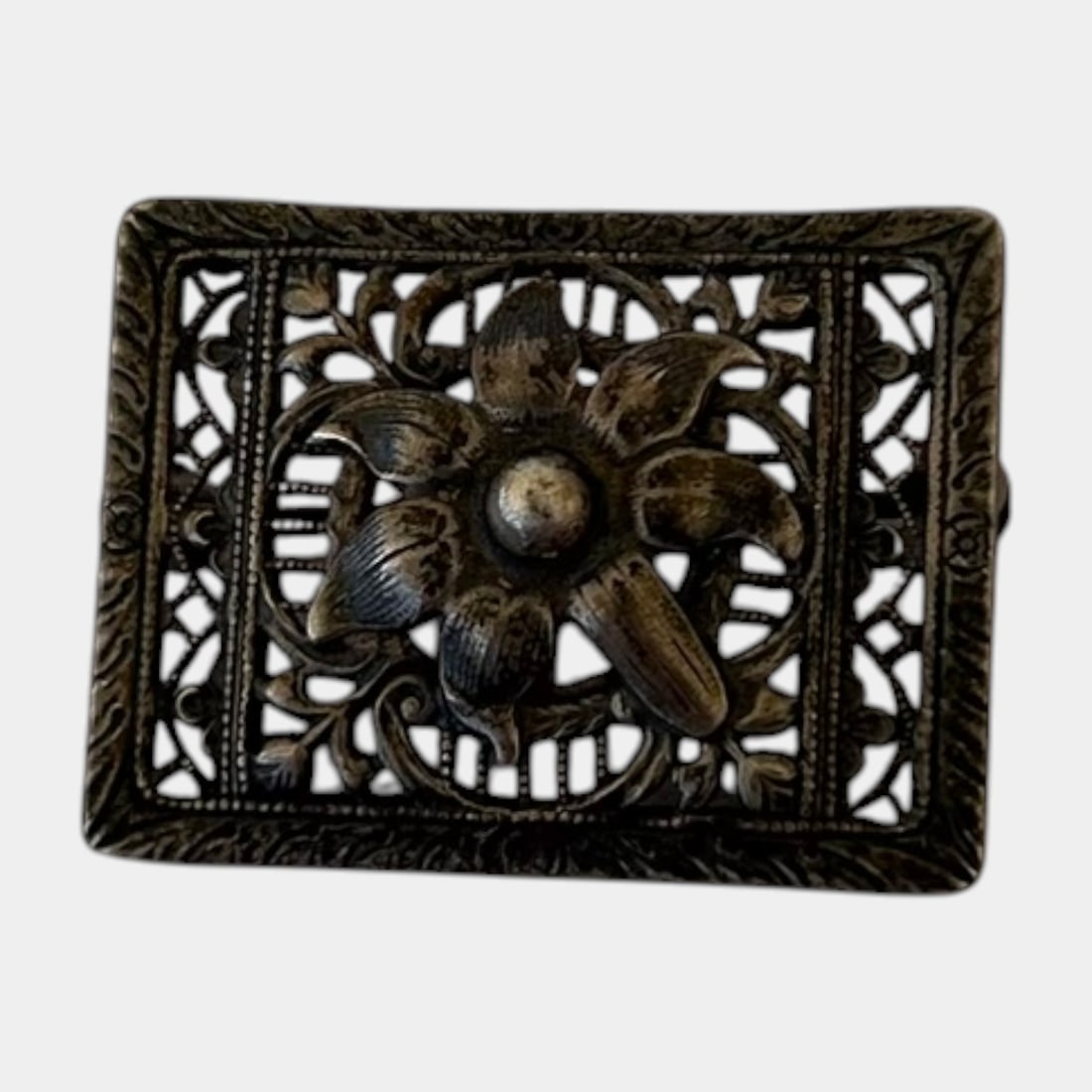 Early 20th Century Sterling Silver Openwork Floral Sash Pin Brooch With Repousse Flower Motif: Professional, fast, and affordable in house shipping available for all items.For higher resolution images please visit www.bid.craftedauctions.com Intricately pierced and beautifully detailed, this ea
