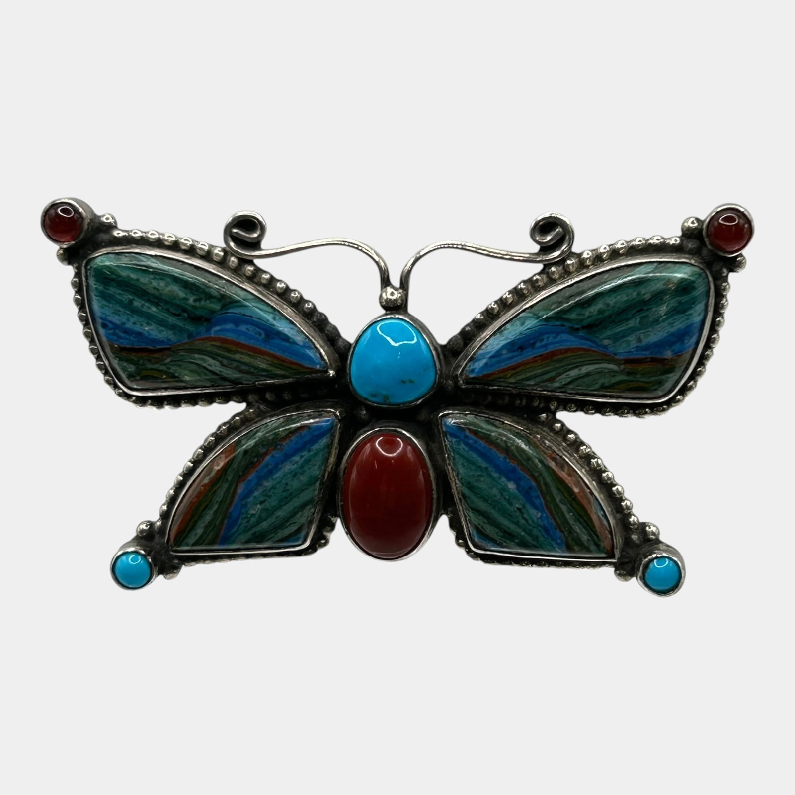 Arnold & Carleena Goodluck Navajo Native American Sterling Silver Inlay Butterfly Brooch Pendant: Professional, fast, and affordable in house shipping available for all items.For higher resolution images please visit www.bid.craftedauctions.com Vibrantly crafted, this Arnold & Carleena Goodluck Na