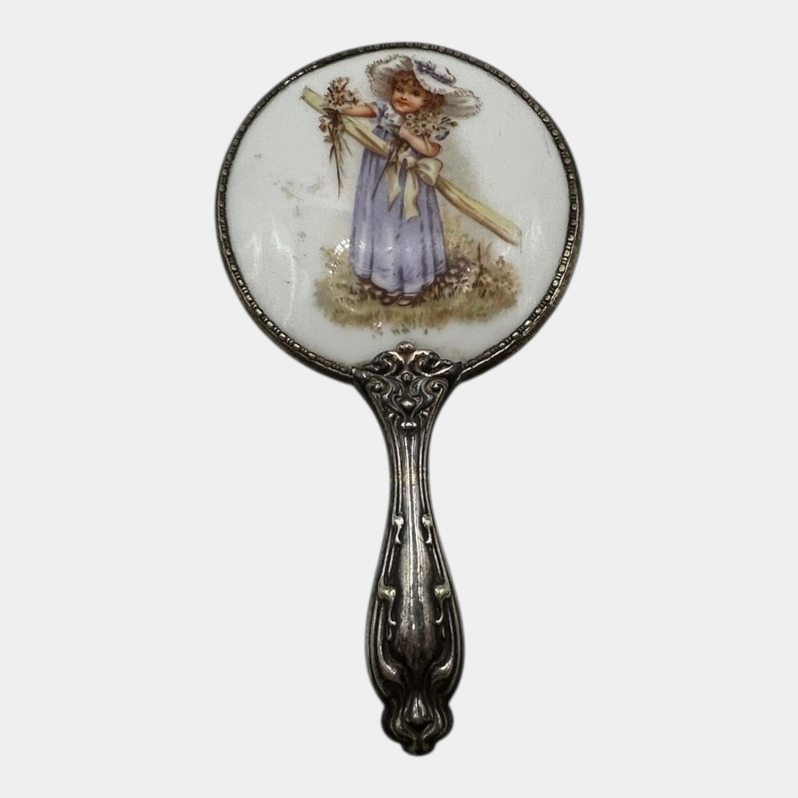 Early 20th Century Sterling Silver Framed Hand Mirror With Hand Painted Porcelain Plaque: Professional, fast, and affordable in house shipping available for all items.For higher resolution images please visit www.bid.craftedauctions.com Charming hand mirror featuring a finely hand-painted 