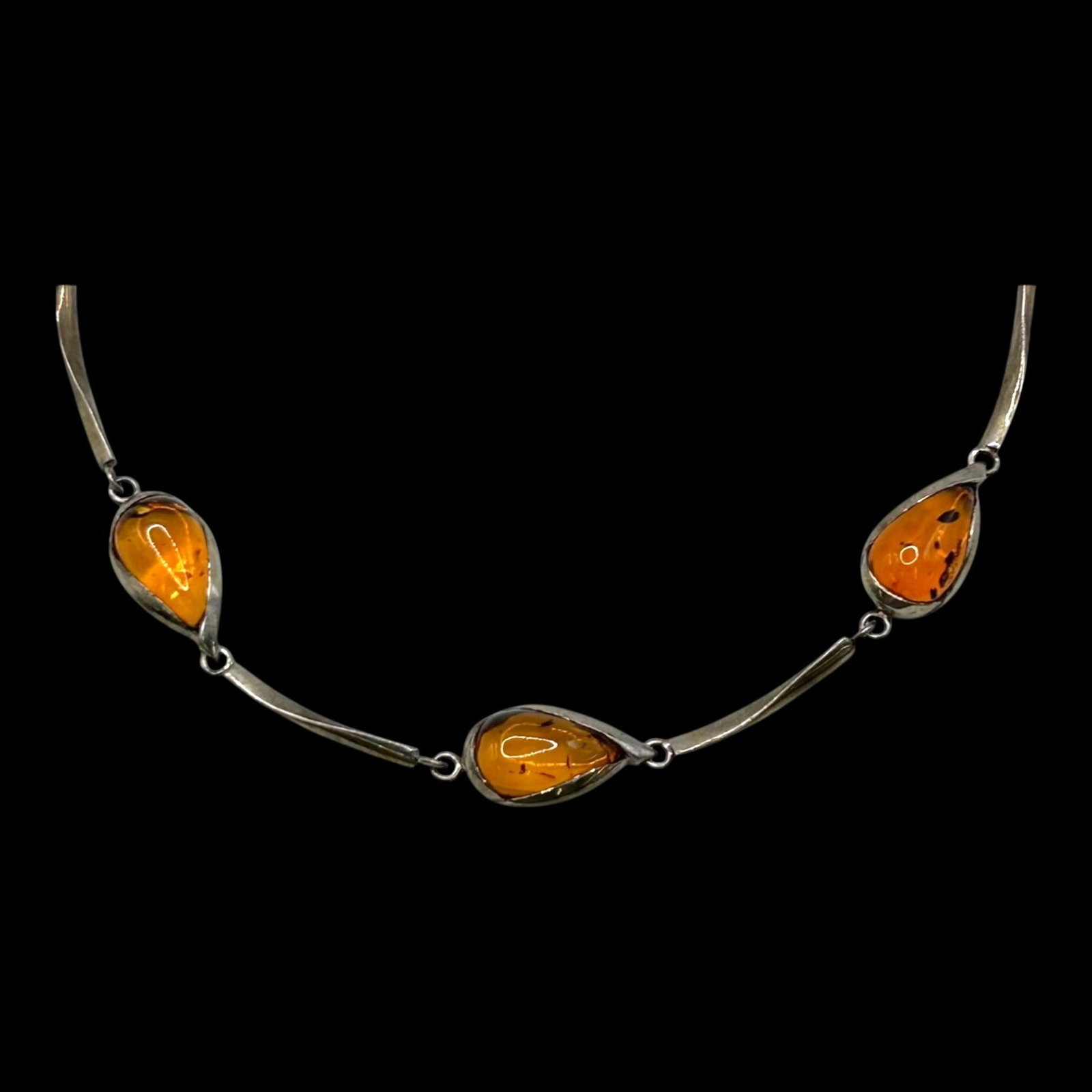 Sterling Silver Modernist Graduated Amber Cabochon Curved Bar Link Statement Necklace: Professional, fast, and affordable in house shipping available for all items.For higher resolution images please visit bid.craftedauctions.com Elegant sterling silver Modernist necklace featuring thre