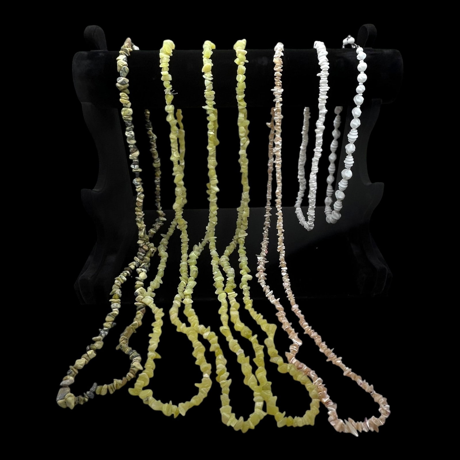 Costume Jewelry Carved Stone Chip Beaded Necklaces White Pink Green Gray Seven Piece Lot: Professional, fast, and affordable in house shipping available for all items.For higher resolution images please visit bid.craftedauctions.com Naturally styled, this seven-piece costume jewelry lot fe