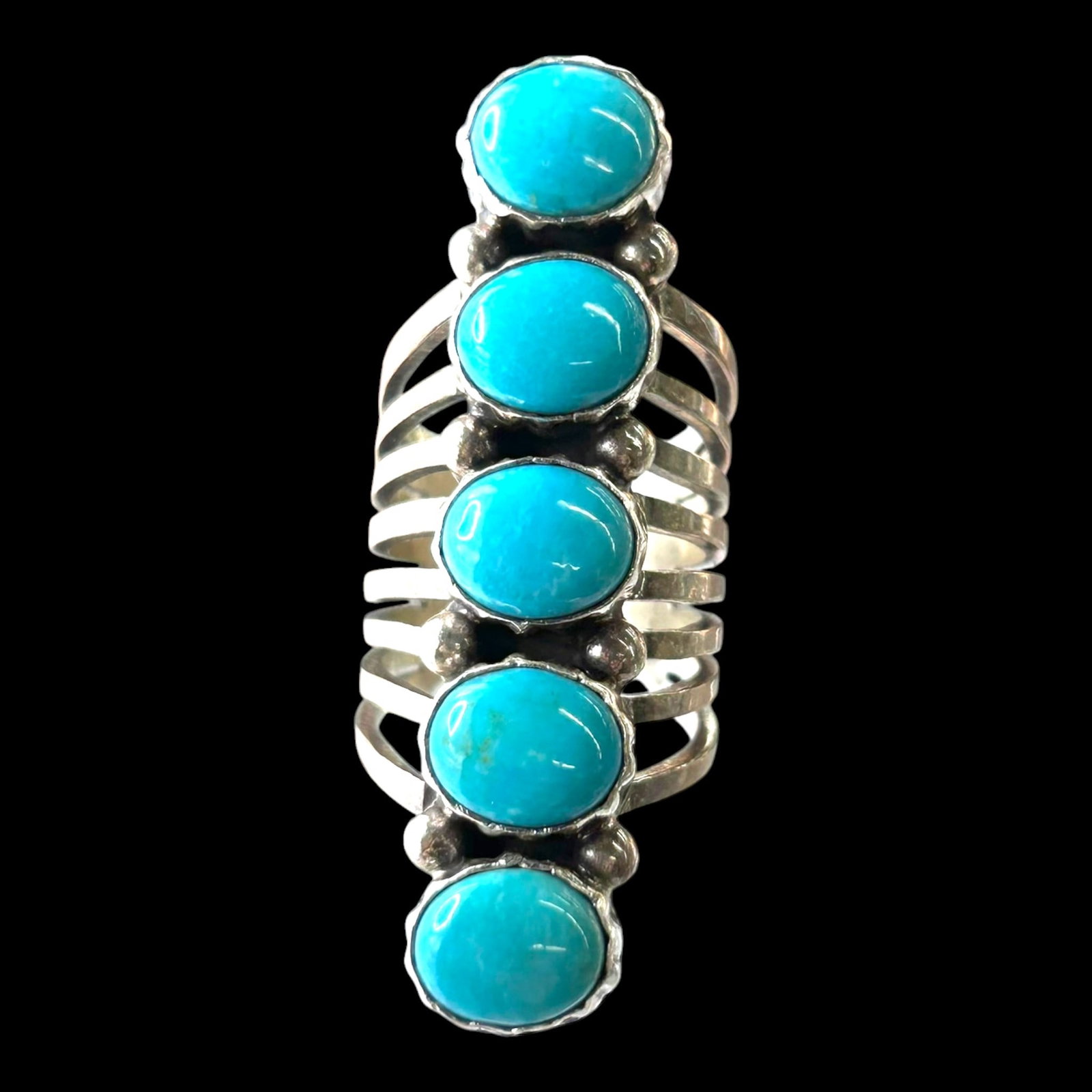 Sterling Silver Turquoise Native American Ring: Professional, fast, and affordable in house shipping available for all items.For higher resolution images please visit bid.craftedauctions.com Boldly crafted, this sterling silver ring features five o