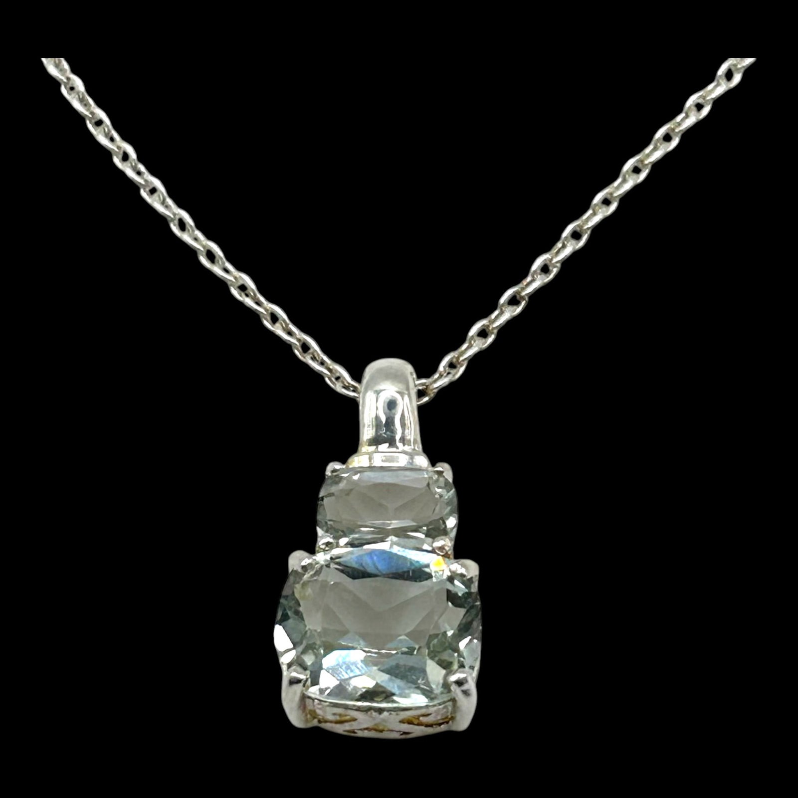 Sterling Silver Clear Gemstone Pendant Necklace With Cushion & Emerald Cut Stone: Professional, fast, and affordable in house shipping available for all items.For higher resolution images please visit bid.craftedauctions.com Elegantly styled, this sterling silver necklace features 