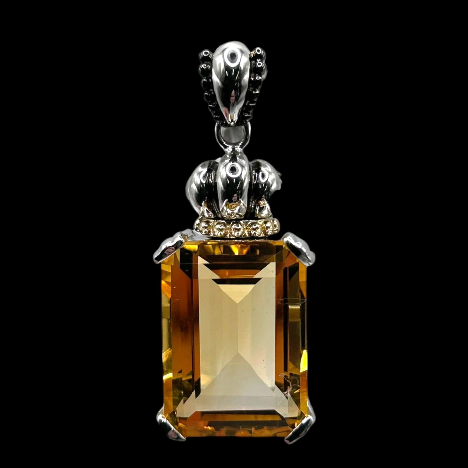 Sterling Silver & 10K Gold Accents Citrine Pendant With Diamond Accent Bail Statement Design: Professional, fast, and affordable in house shipping available for all items.For higher resolution images please visit bid.craftedauctions.com Boldly elegant, this sterling silver pendant features a l