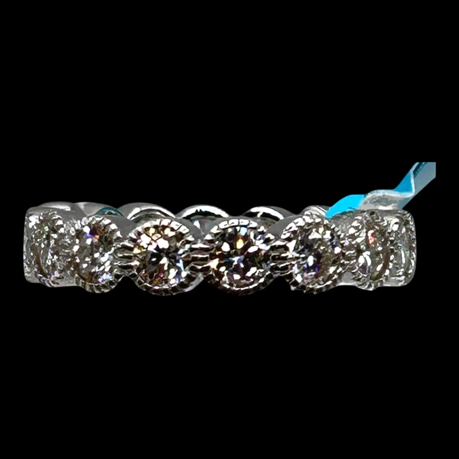 Sterling Silver Moissanite Eternity Band Ring With Scalloped Openwork Gallery Design: Professional, fast, and affordable in house shipping available for all items.For higher resolution images please visit bid.craftedauctions.com Brilliantly crafted, this sterling silver eternity band f