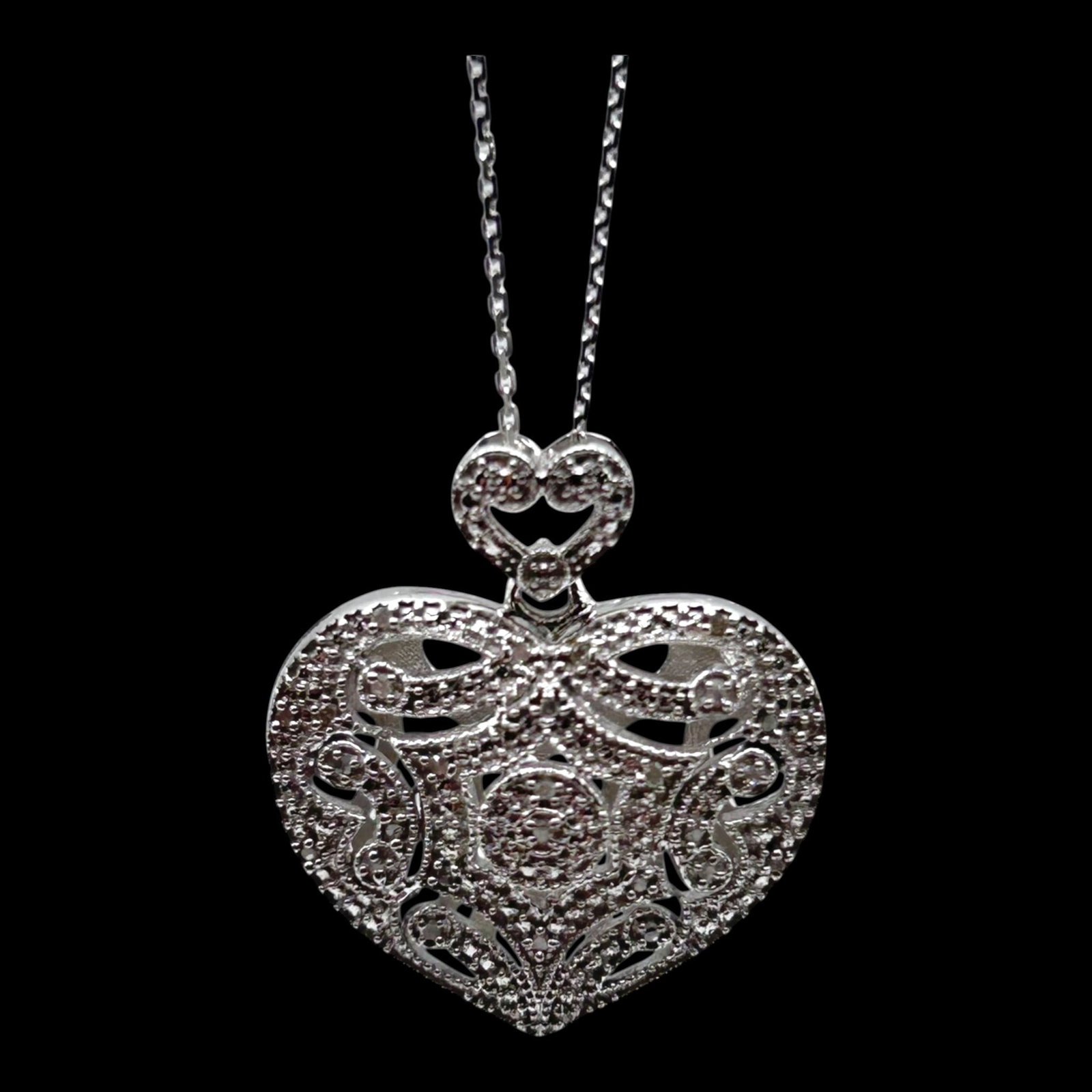 Sterling Silver Filigree Heart Pendant Necklace With Openwork Scroll And Lacework Design: Professional, fast, and affordable in house shipping available for all items.For higher resolution images please visit bid.craftedauctions.com Delicately crafted, this sterling silver necklace feature