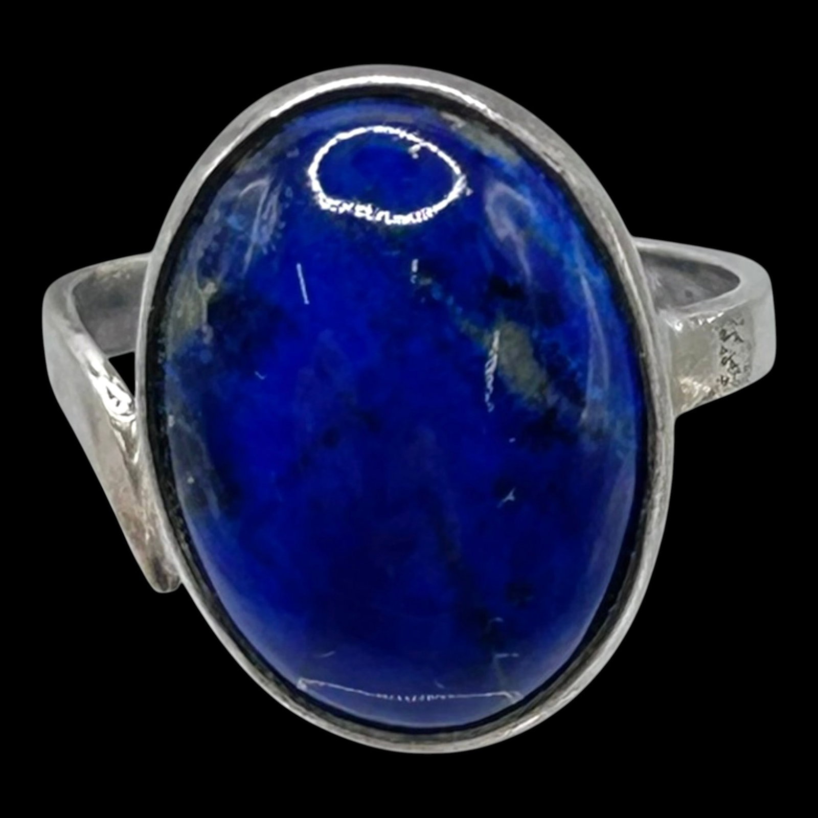 Sterling Silver Large Blue Cabochon Ring With Bezel Set Statement Design: Professional, fast, and affordable in house shipping available for all items.For higher resolution images please visit bid.craftedauctions.com Boldly elegant, this sterling silver ring showcases a lar