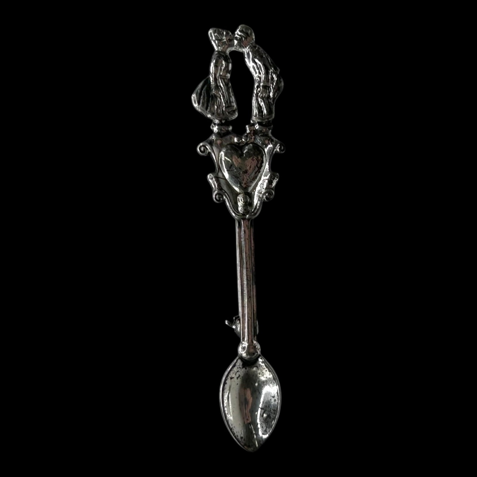 Sterling Silver Figural Kissing Couple Spoon Pendant With Heart Motif Ornate Romantic Design: Professional, fast, and affordable in house shipping available for all items.For higher resolution images please visit bid.craftedauctions.com Charmingly detailed, this sterling silver spoon pendant f