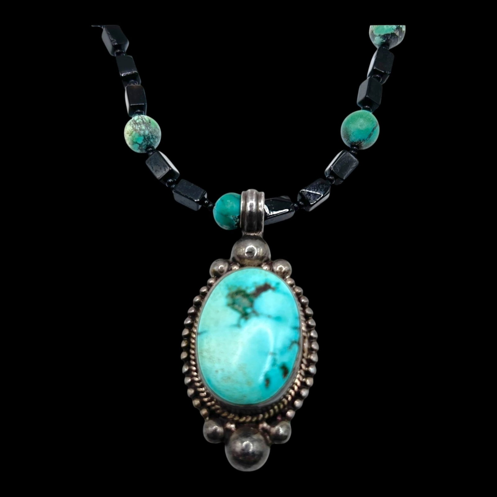 Sterling Silver Turquoise Pendant Necklace With Black Onyx Beads And Beaded Border Design: Professional, fast, and affordable in house shipping available for all items.For higher resolution images please visit bid.craftedauctions.com Boldly handcrafted, this sterling silver necklace feature