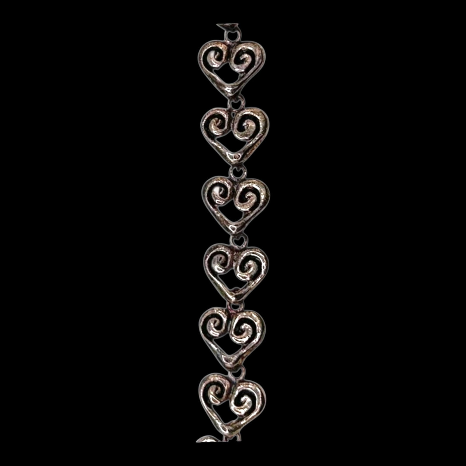 Sterling Silver Openwork Heart Link Bracelet With Scroll Motifs And Romantic Filigree Design: Professional, fast, and affordable in house shipping available for all items.For higher resolution images please visit bid.craftedauctions.com Delicately crafted, this sterling silver bracelet feature