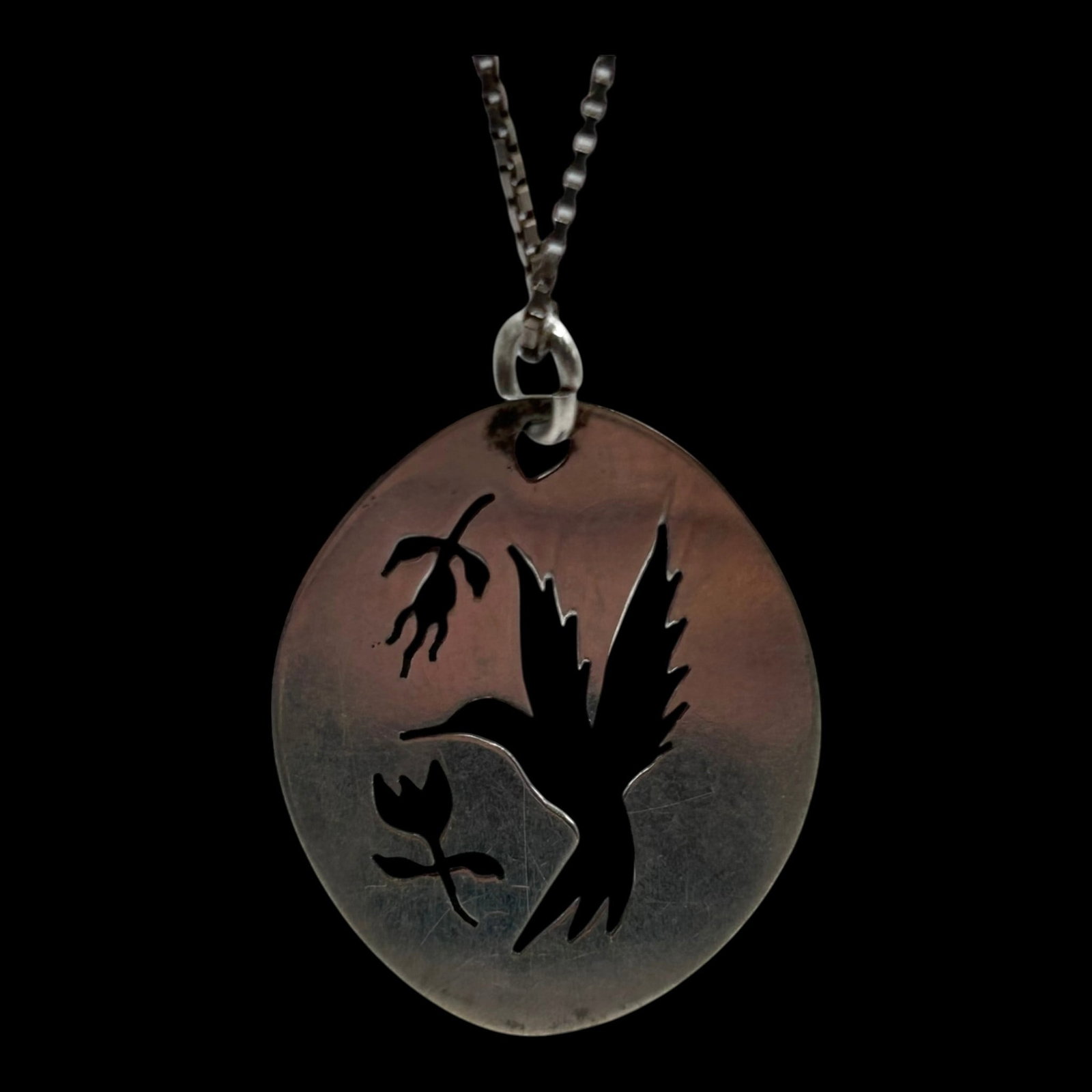 Sterling Silver Hummingbird Cutout Pendant Necklace With Floral Nature Scene Oval Design: Professional, fast, and affordable in house shipping available for all items.For higher resolution images please visit bid.craftedauctions.com Artfully handcrafted, this sterling silver necklace featu