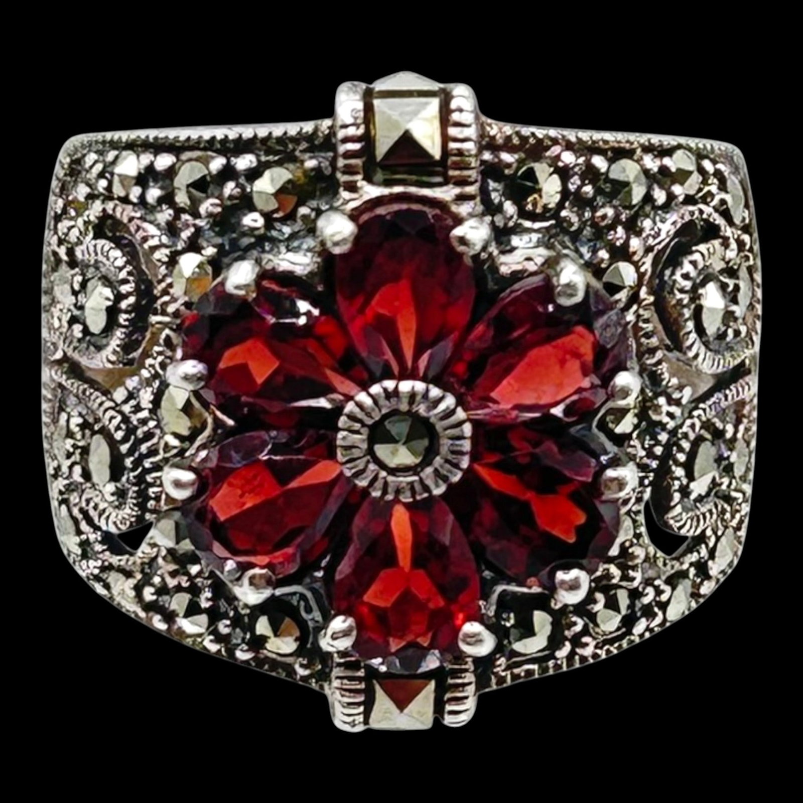 Sterling Silver 925 Garnet & Marcasite Floral Cluster Ring With Ornate Scrollwork Shoulders: Professional, fast, and affordable in house shipping available for all items.For higher resolution images please visit bid.craftedauctions.com Richly detailed, this sterling silver ring features a flo