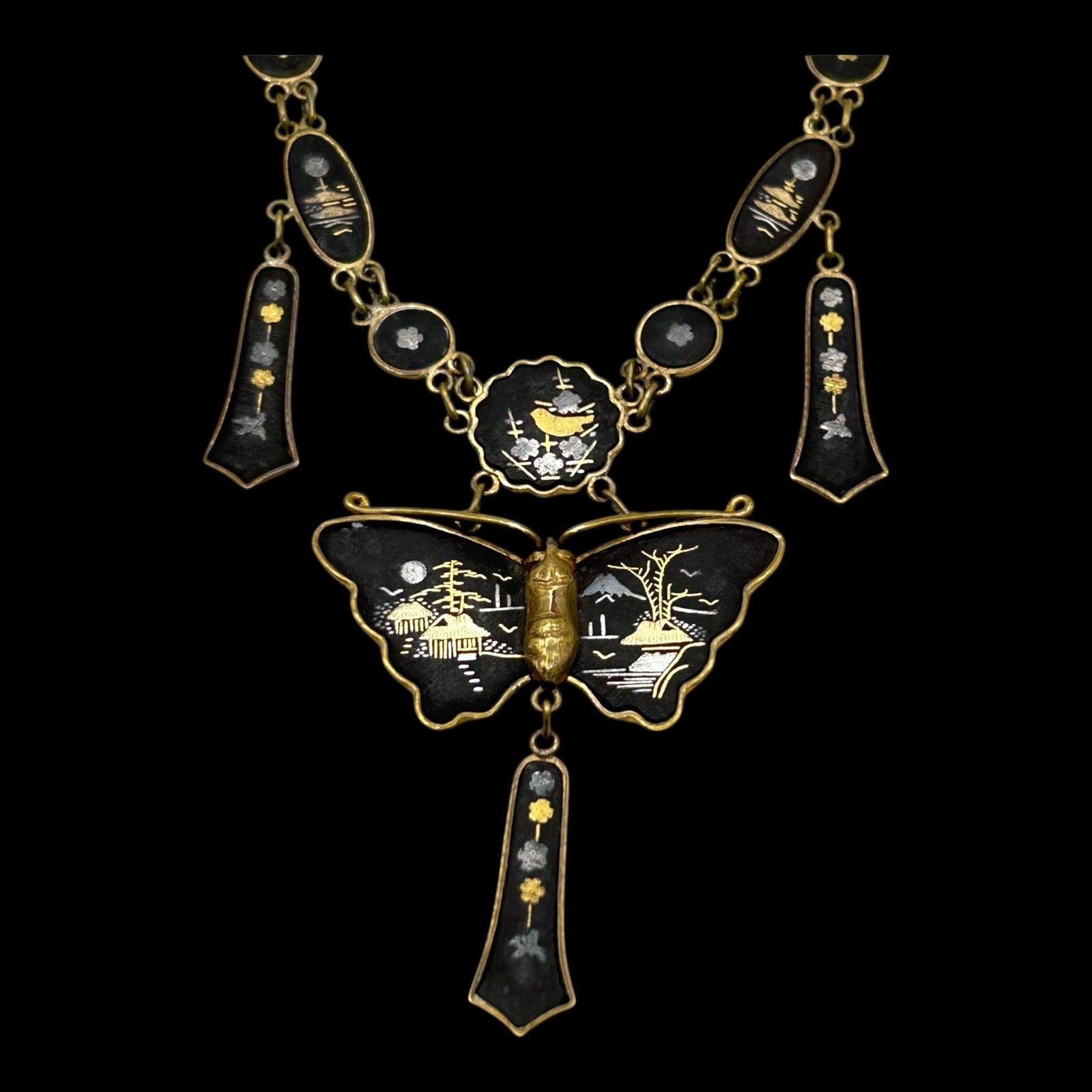 Japanese Damascene Black & Gold Butterfly Necklace With Scenic Panels And Dangle Drops: Professional, fast, and affordable in house shipping available for all items.For higher resolution images please visit bid.craftedauctions.com Beautifully detailed, this Japanese damascene necklace fe